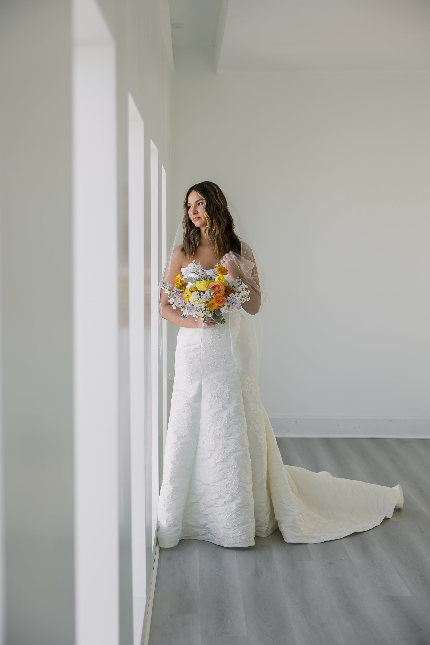 A Bride poses for a photo inside the photo studio at The Gallery House