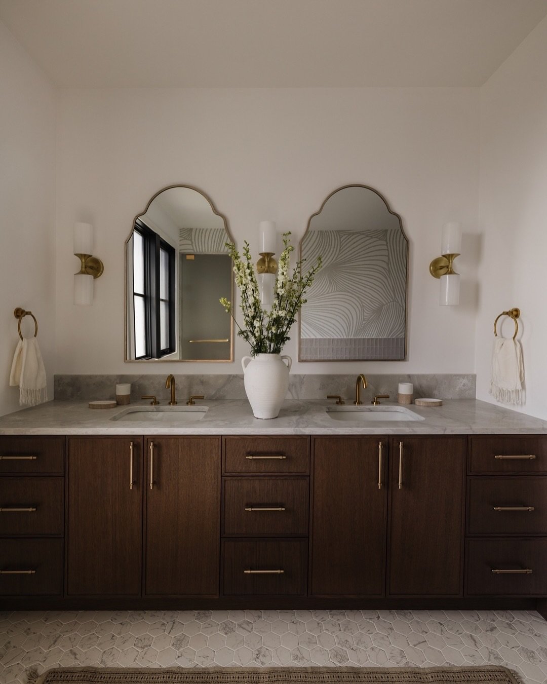 Primary. The primary bath at #AVDParkHill is a gorgeous retreat inspired by a hammam spa. Mosaic floors, marble countertops, and beautiful handmade wall tiles are elevated with brass fixtures and accents as well as a gorgeous wallpaper feature. This 