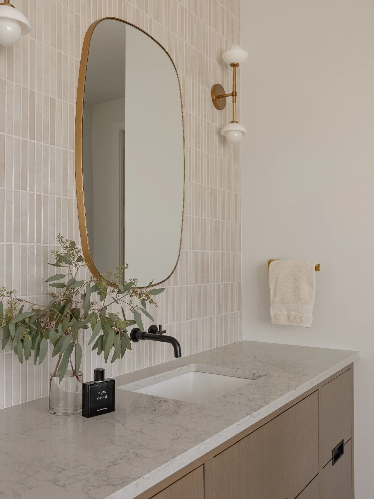 Update. We opted to update the primary bathroom at #AVDElbowPark with some new vertical tiles, lighting and mirrors. This really gave the space a brand new feeling and helped keep budgets in check. Swipe to see the before. 
⠀⠀⠀⠀⠀⠀⠀⠀⠀
Interior Design: