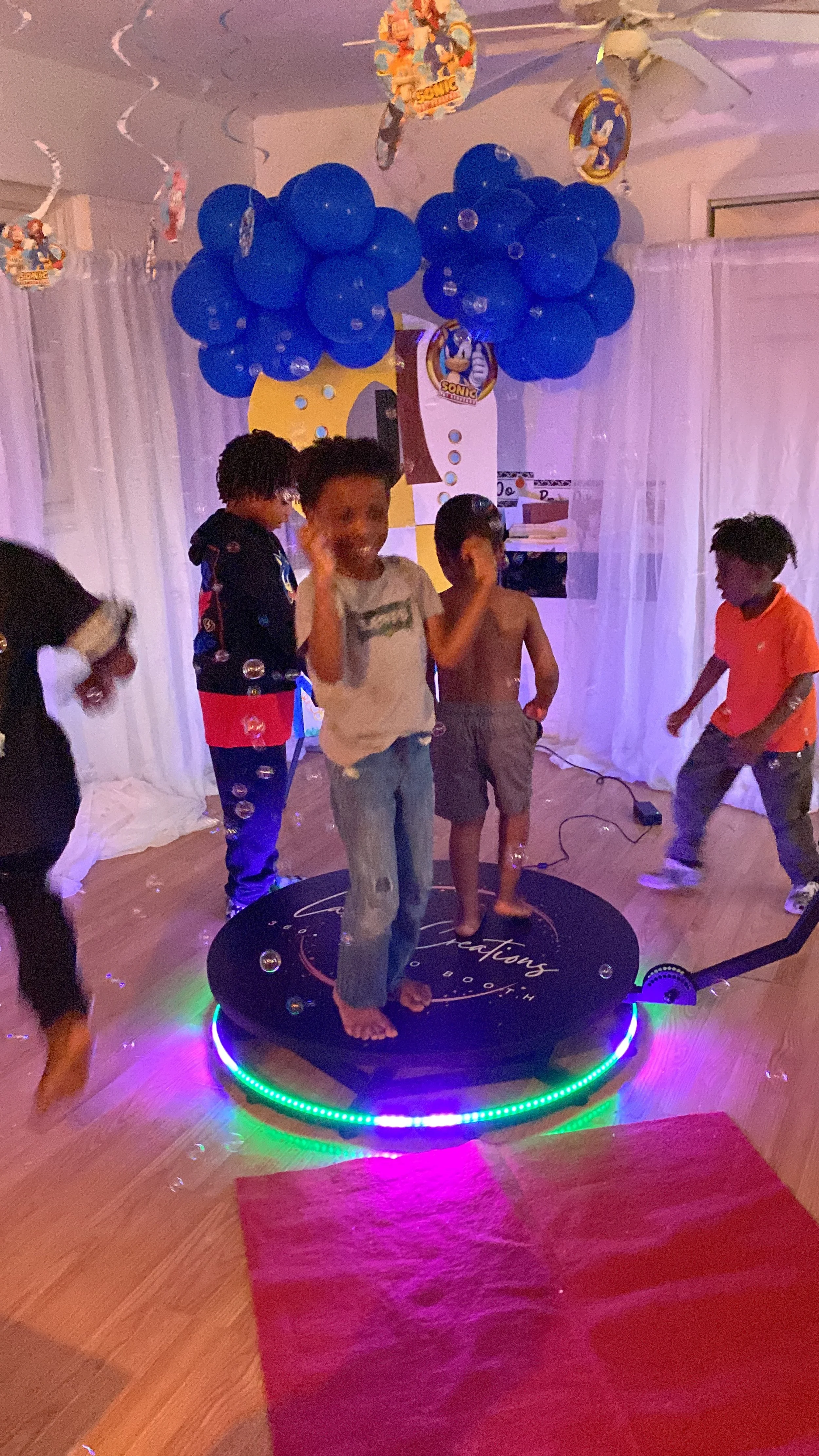 A vibrant Sonic-themed birthday party featuring a custom-designed backdrop, personalized marquee signage, and a 360 PhotoBooth rental — expertly styled by Moments Planning for a fun, immersive, and unforgettable celebration experience.
