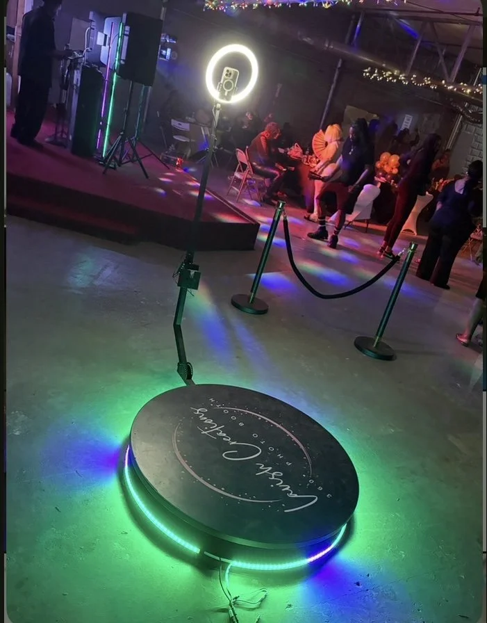 Luxury 360 Photo Booth platform with LED lighting and velvet ropes — capturing every angle of unforgettable celebrations.