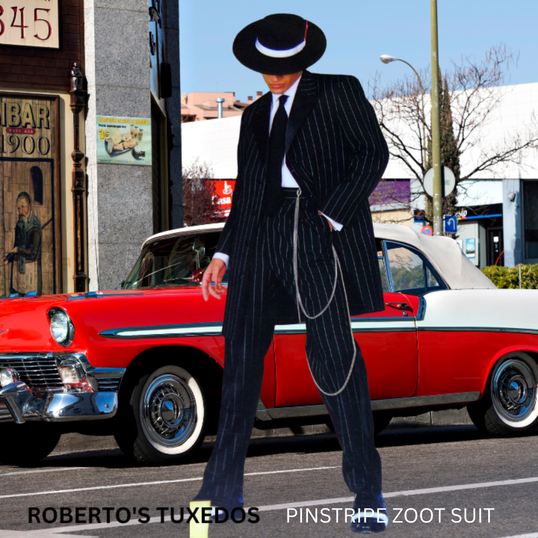 Person dressed in a black Pinstripe Zoot Suit with a red and white hat, standing in front of a vintage red and white car on a city street.