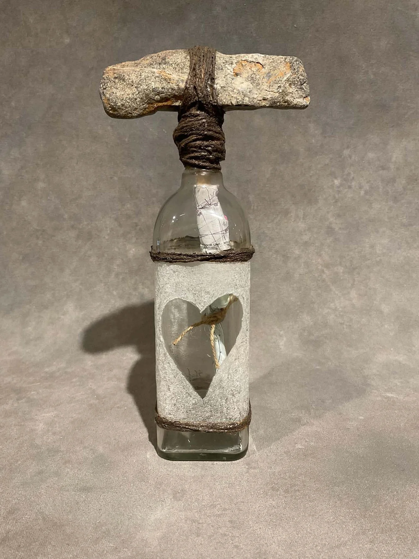 Steve Jensen 
 Message in a Bottle (Stone)  
13x6.5x3 
found bottle rope rock vintage nautical chart 
$350