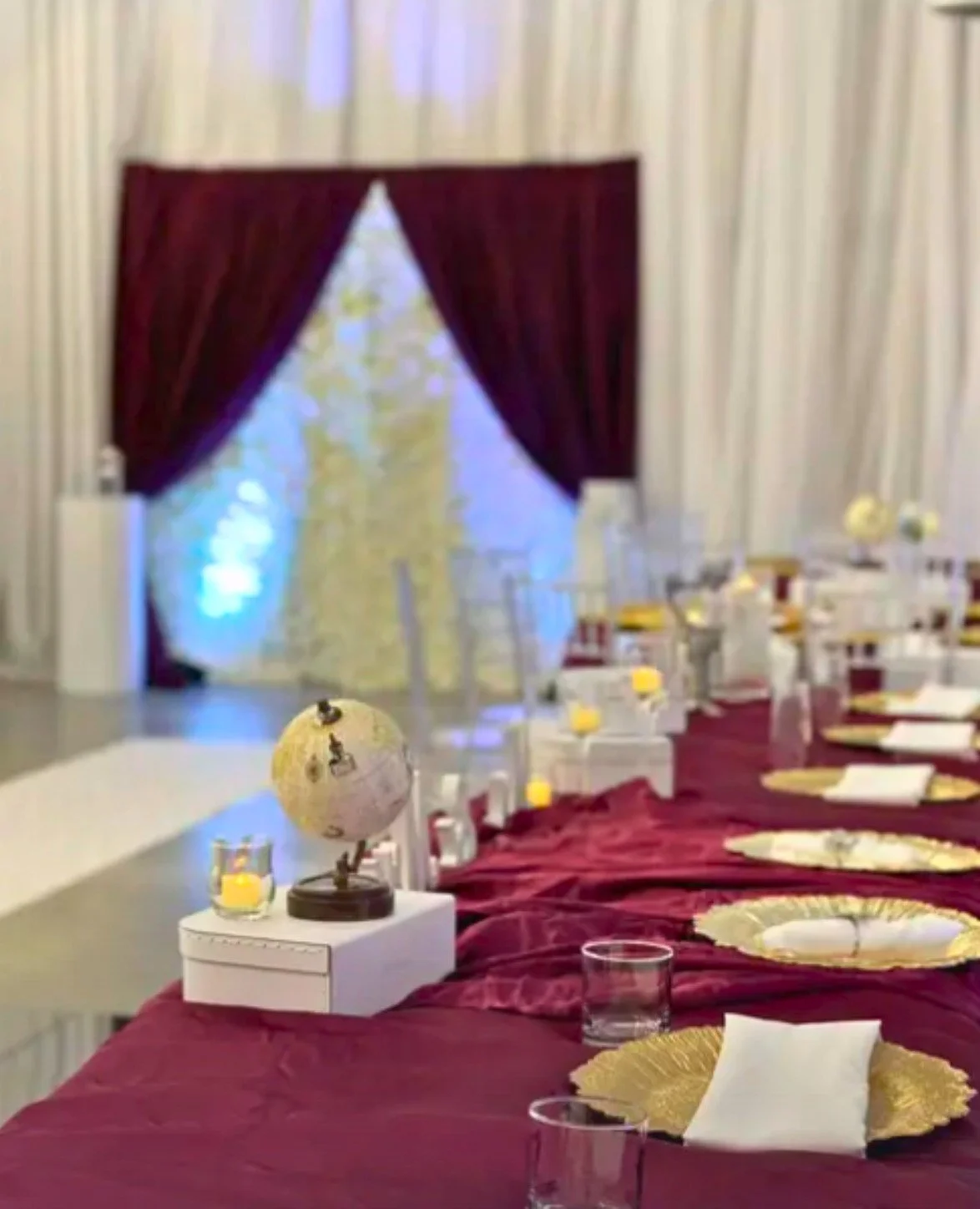 Fully customized "all-around-the world" wedding with custom centerpieces, backdrop, and seating arrangement.