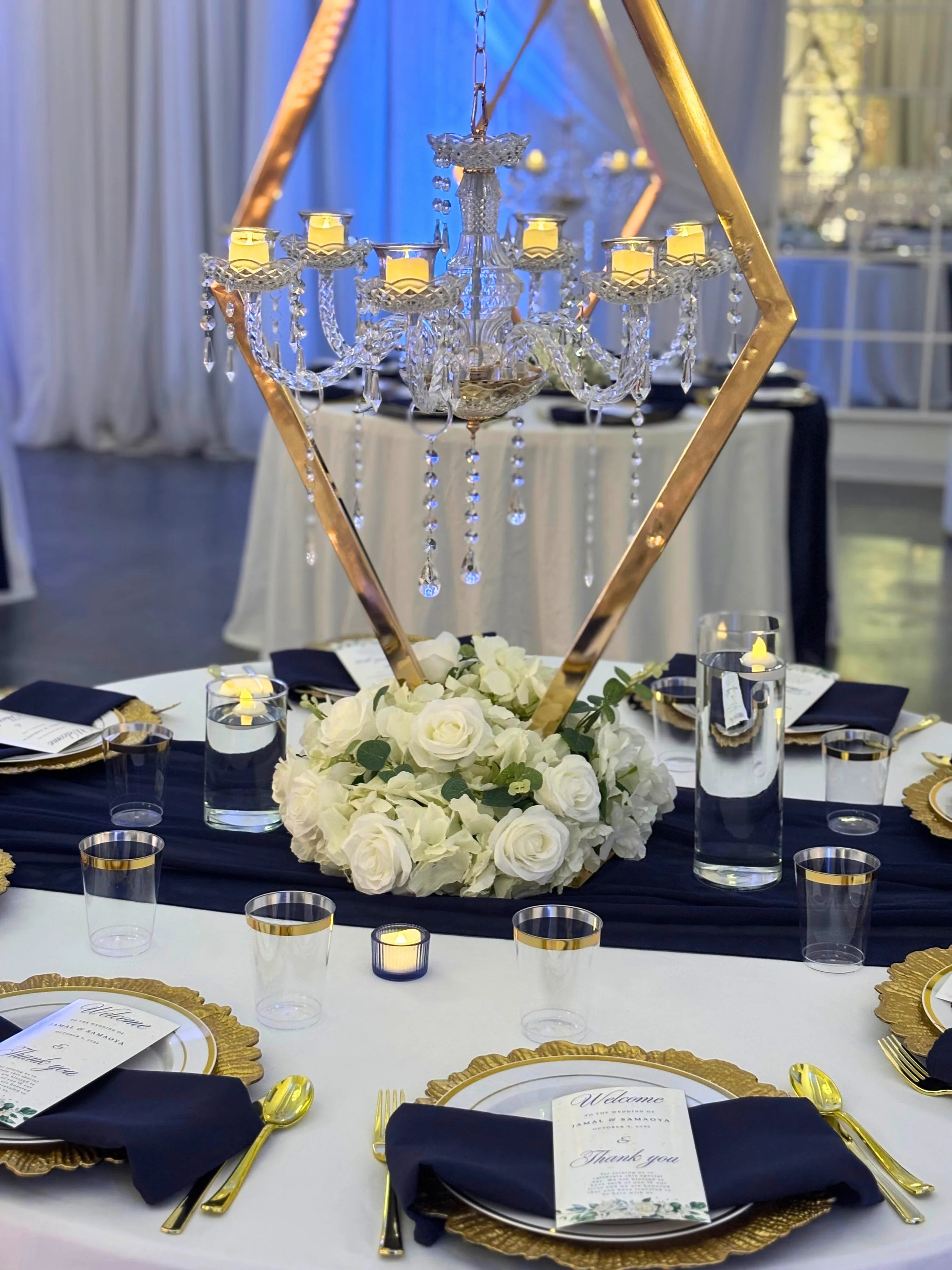 Luxury guest table decor with gold and blue decor at De La Rosa Event Space in Marietta