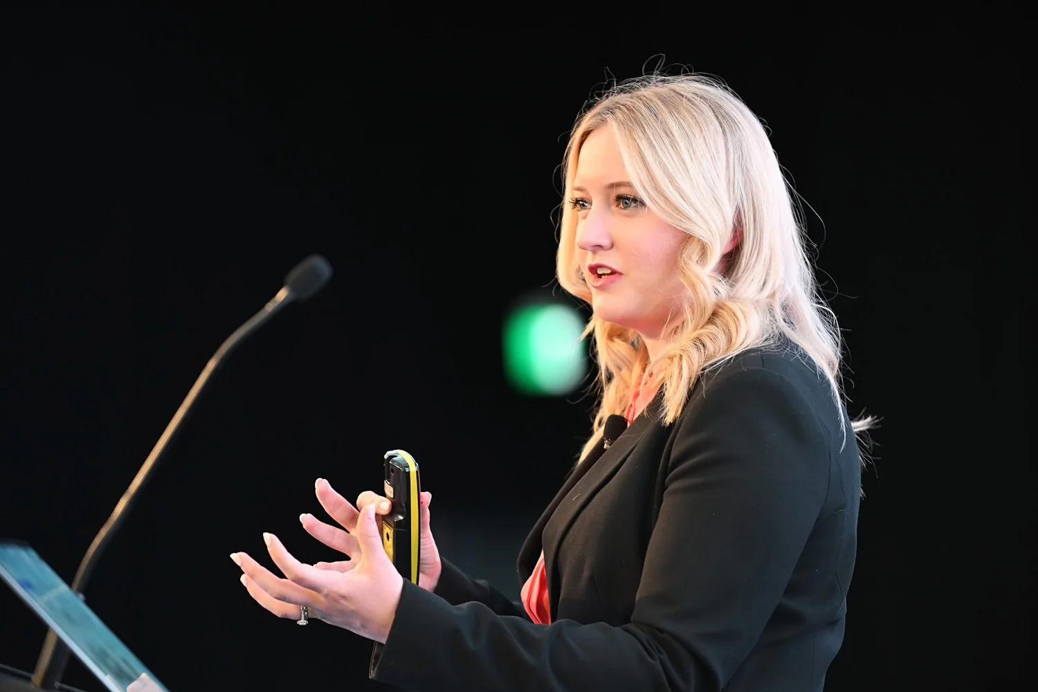 Futurist Ashley Fell, author of Work Wellbeing, presenting research-backed insights to a corporate audience.