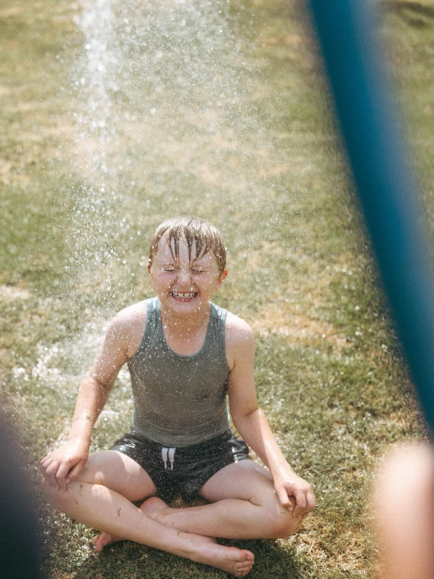Week 51/52:  Shoot Through 

Ahhh, fun running under back yard sprinklers. Is there anything more quintessentially Aussie Summer than that? 🤷&zwj;♀️🫶💦

Shooting through water on this hot summer day and squealing as I try not to get splashed. Time 