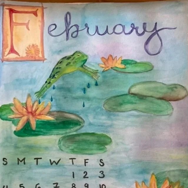 A watercolor painting of a February calendar page with a frog jumping over lily pads and flowers in a pond.