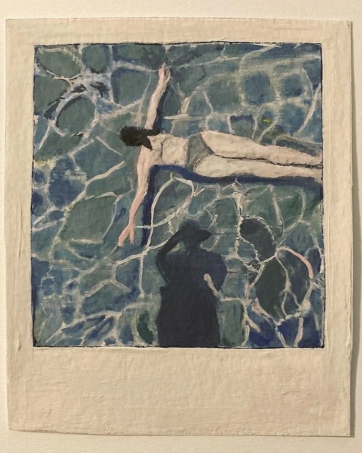 A watercolor of a polaroid of a woman swimming through a pool, with the photographer's shadow visible on the water.