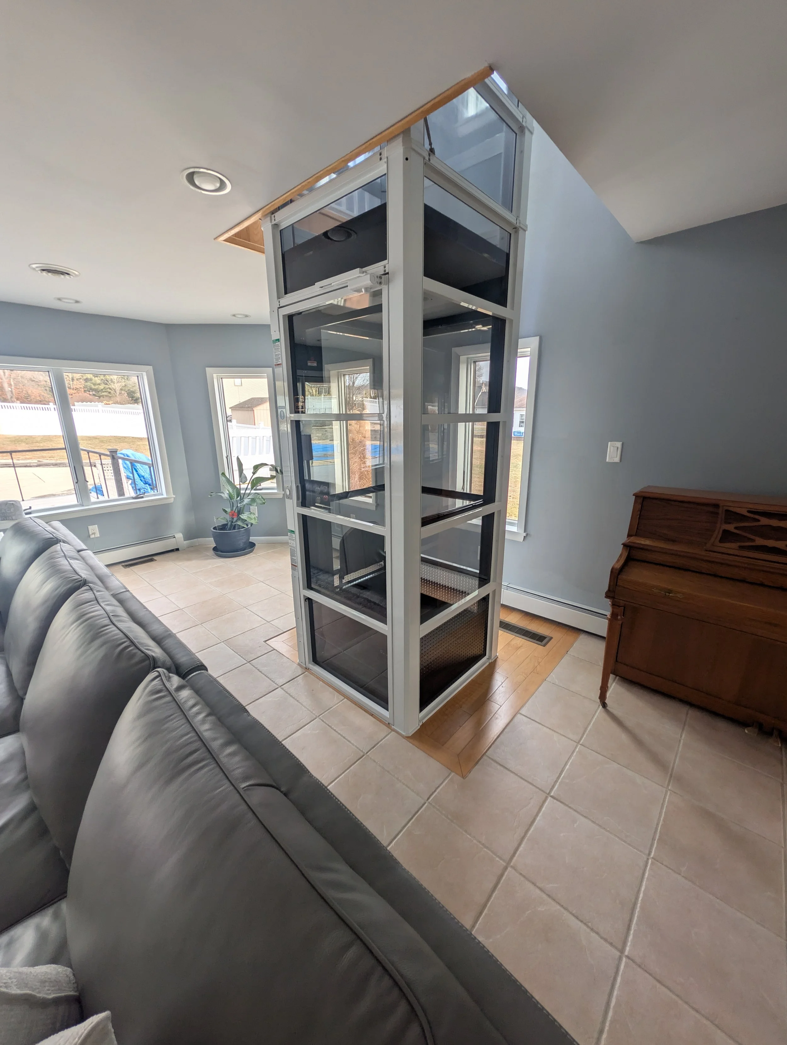 A PVE Cube home elevator that was installed in the place of an old spiral staircase by Keystone Accessibility in west chester pa.