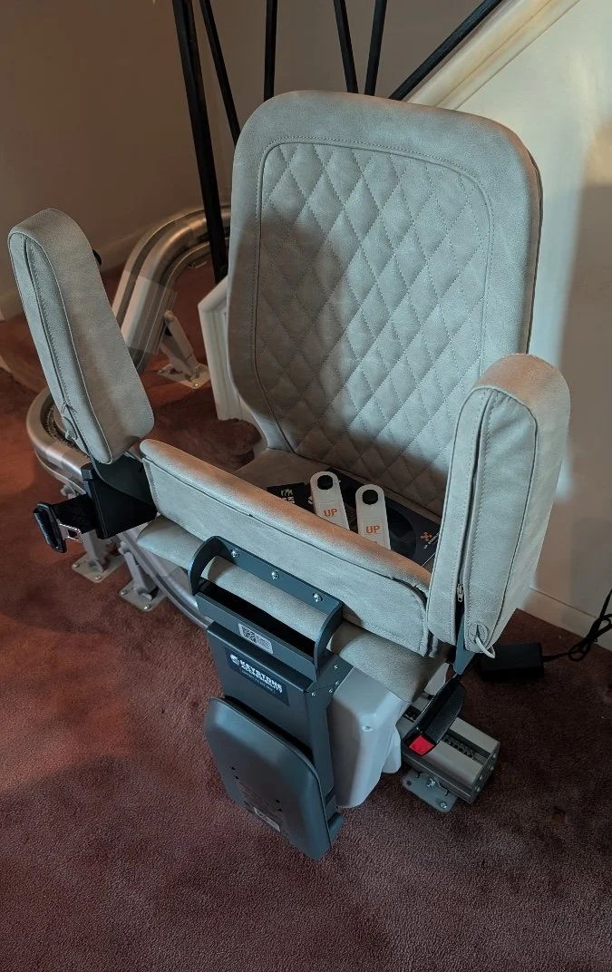 Curved stairlift installation at an affordable price in lancaster pa by Keystone Accessibility. Sand premium cushion seat with joystick controls and remotes.