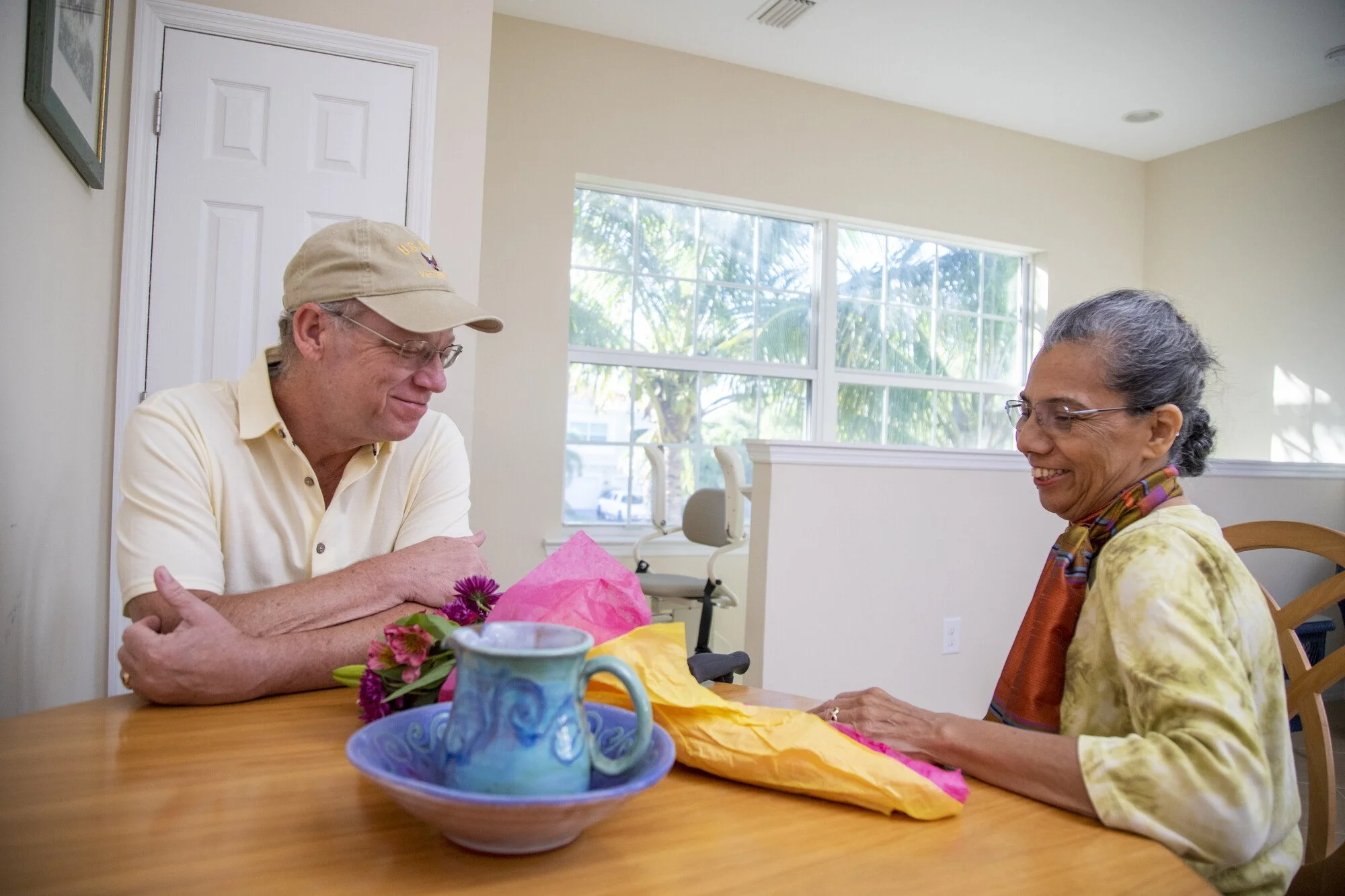 Sitting down at the table for a free stairlift consultation.