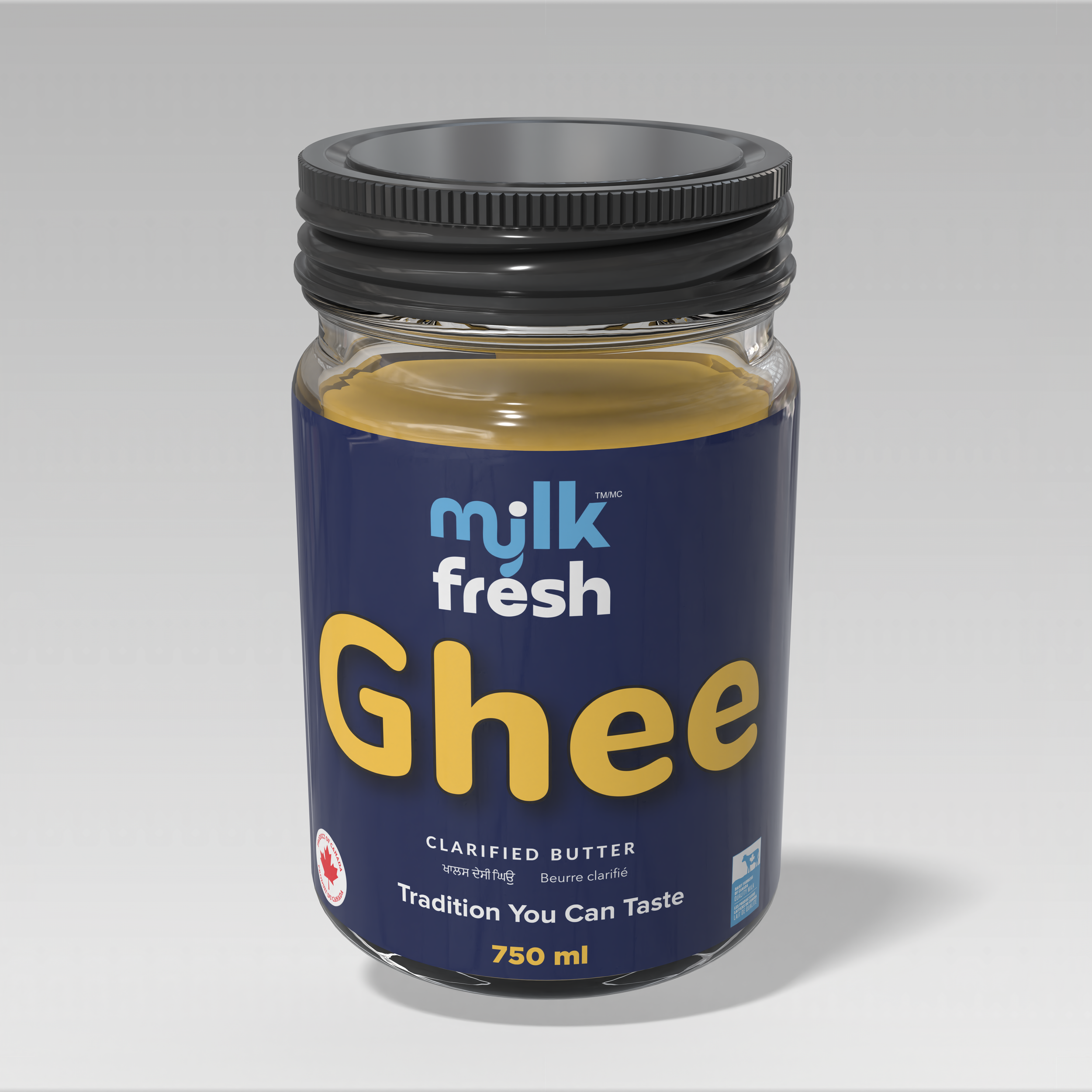 A jar of milk fresh ghee with a blue label, black lid, and gold-colored ghee inside.