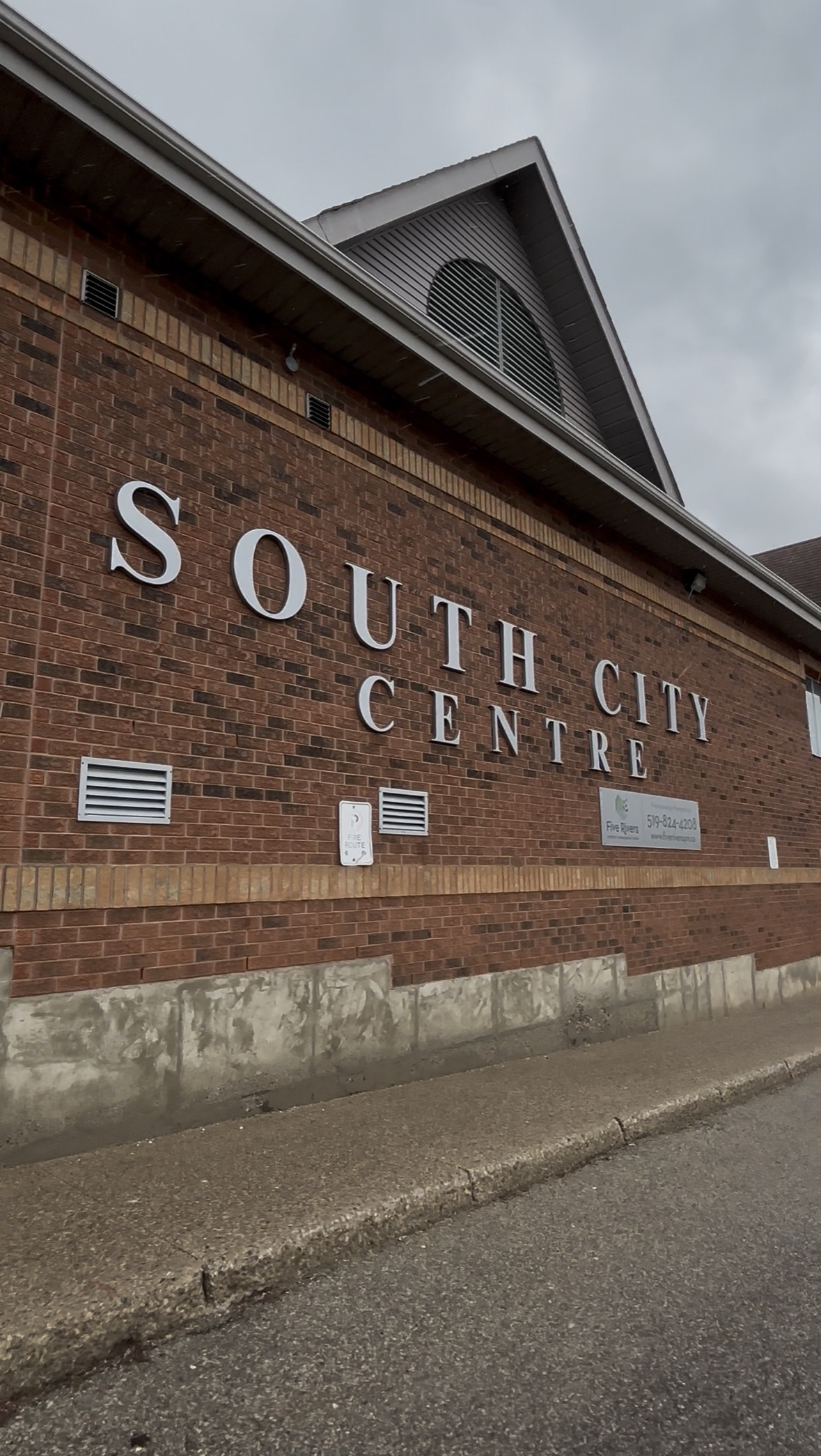 Brick Industrial building with "south city centre" written on the wall 