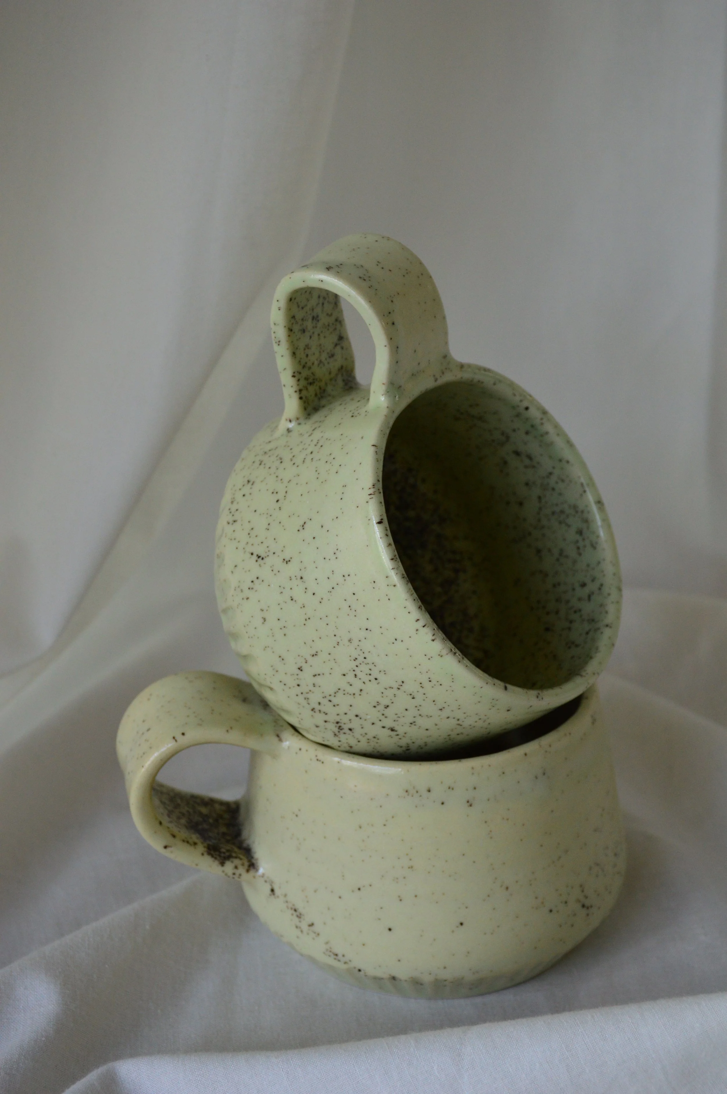 soft green speckled cup