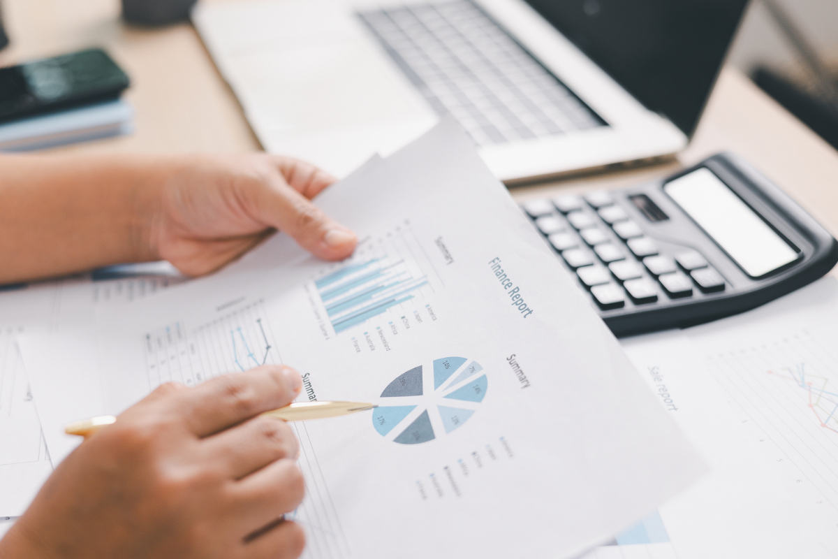 image of a person looking at retail trading analysis reports