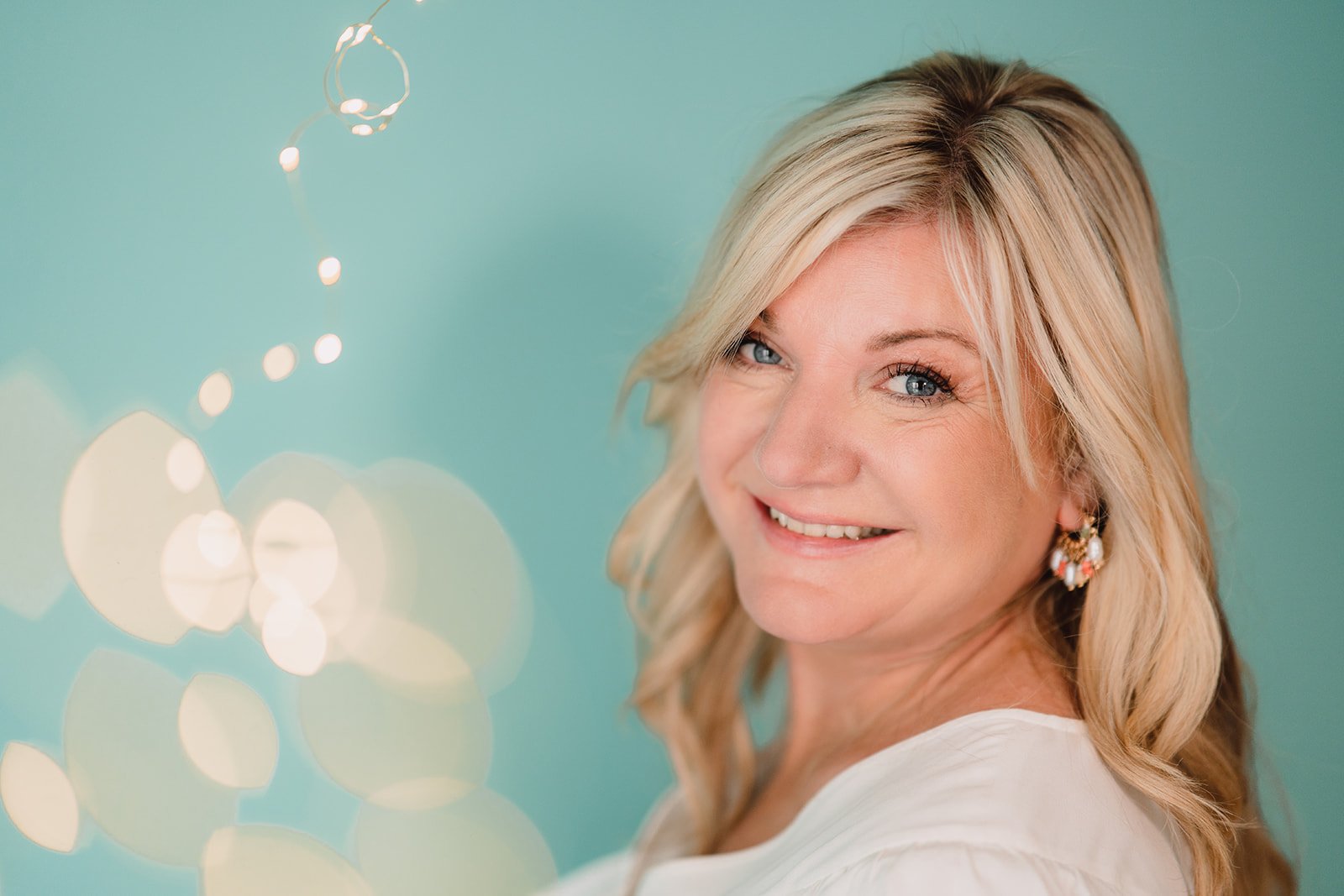 Portrait of Émilie Evans, IAYT accredited Yoga Therapist, detailing her qualifications and personal journey.