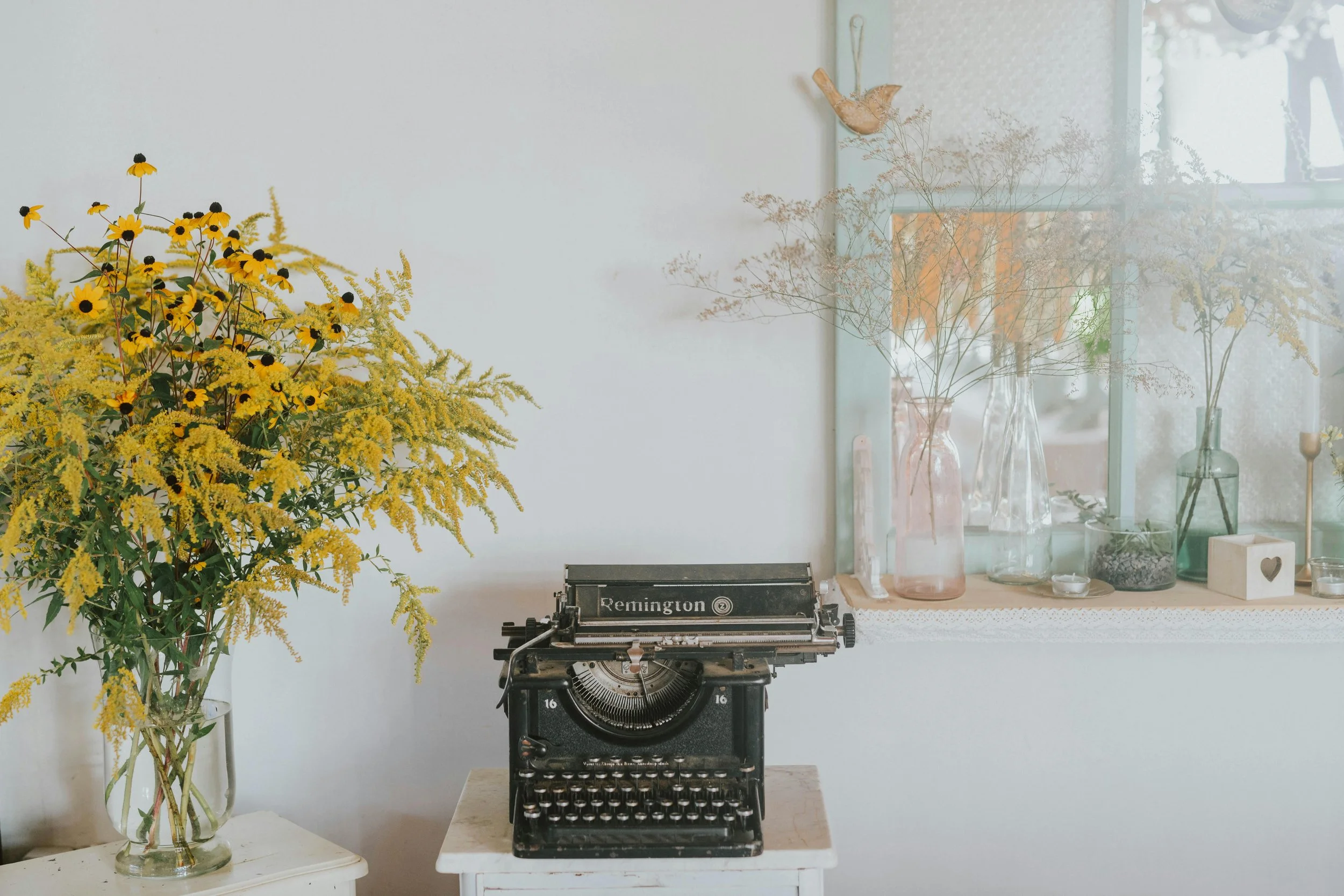 Antique typewriter on a small white table