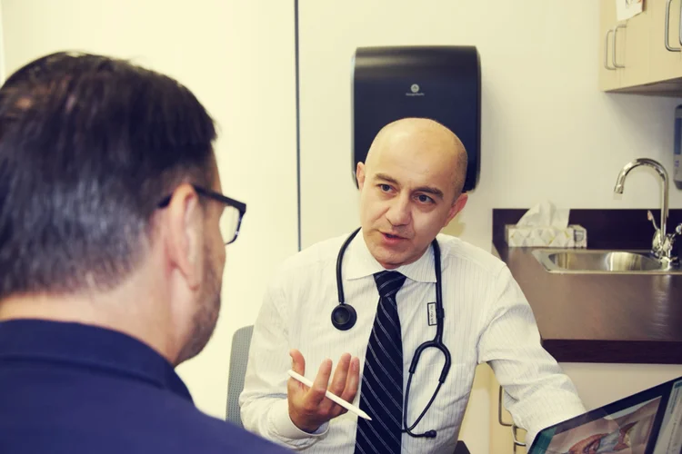 Dr. Farhad Hasan, board-certified endocrinologist, discussing diabetes care with a patient at Chia Endocrinology & Wellness in Wexford, PA, near Pittsburgh