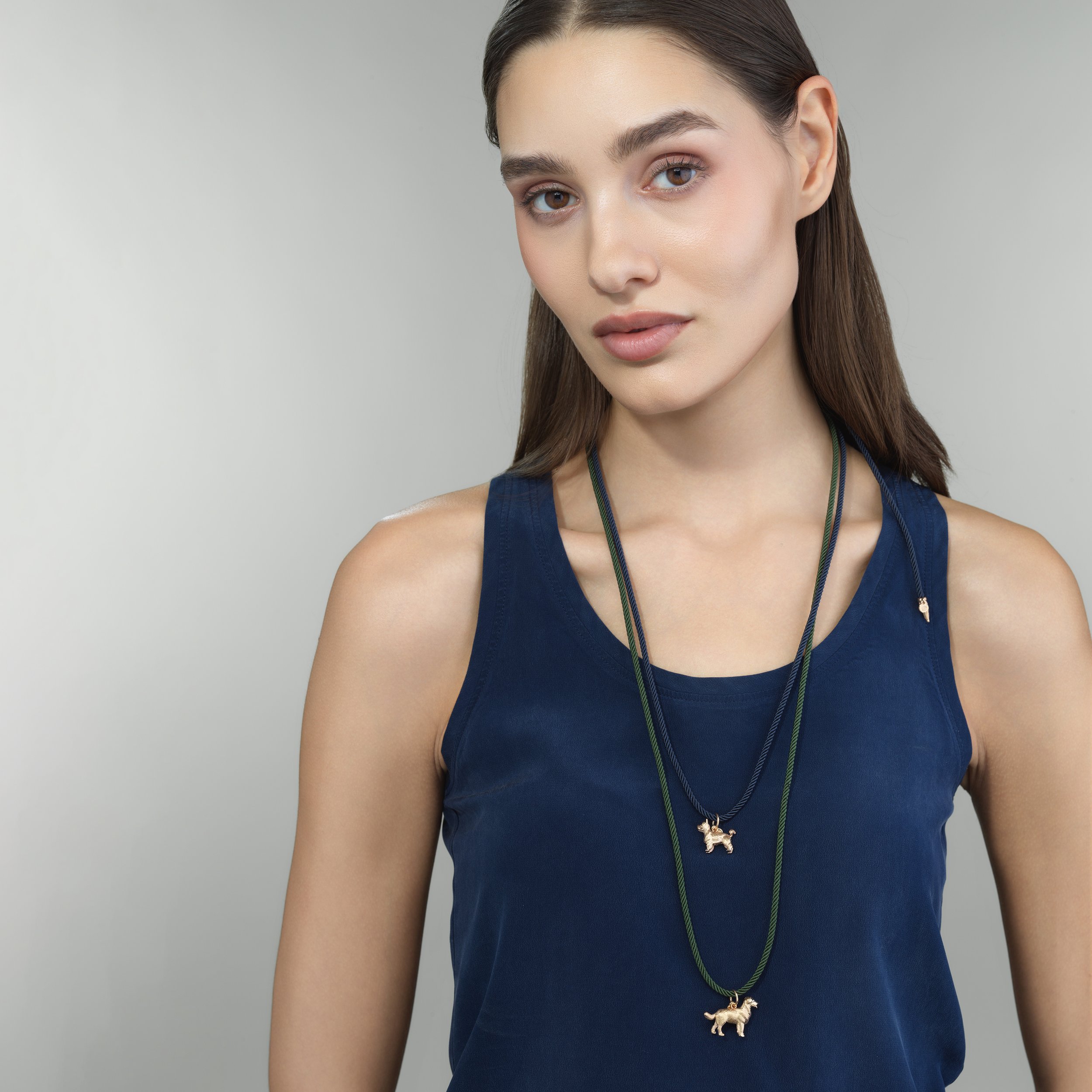 Blue silk cord necklace shown worn on a model for scale