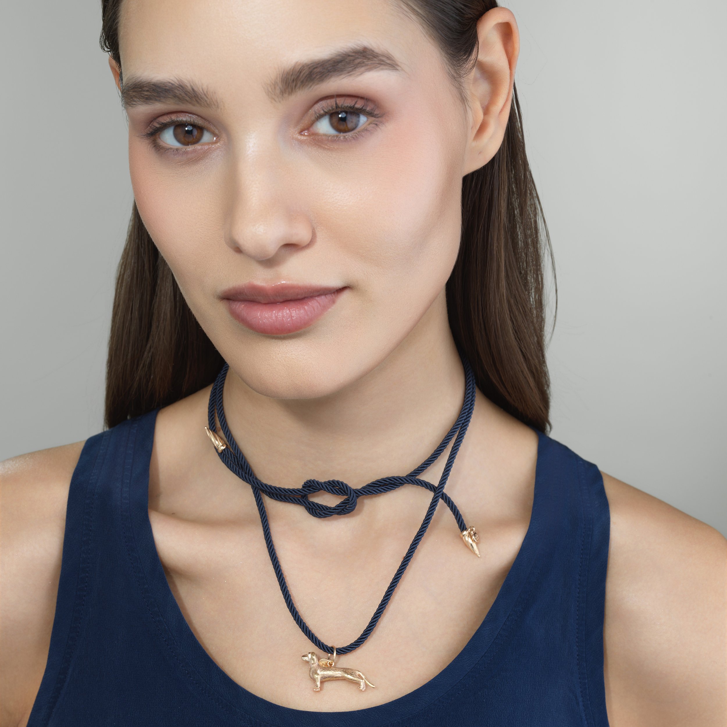 Blue silk cord necklace shown worn on a model for scale