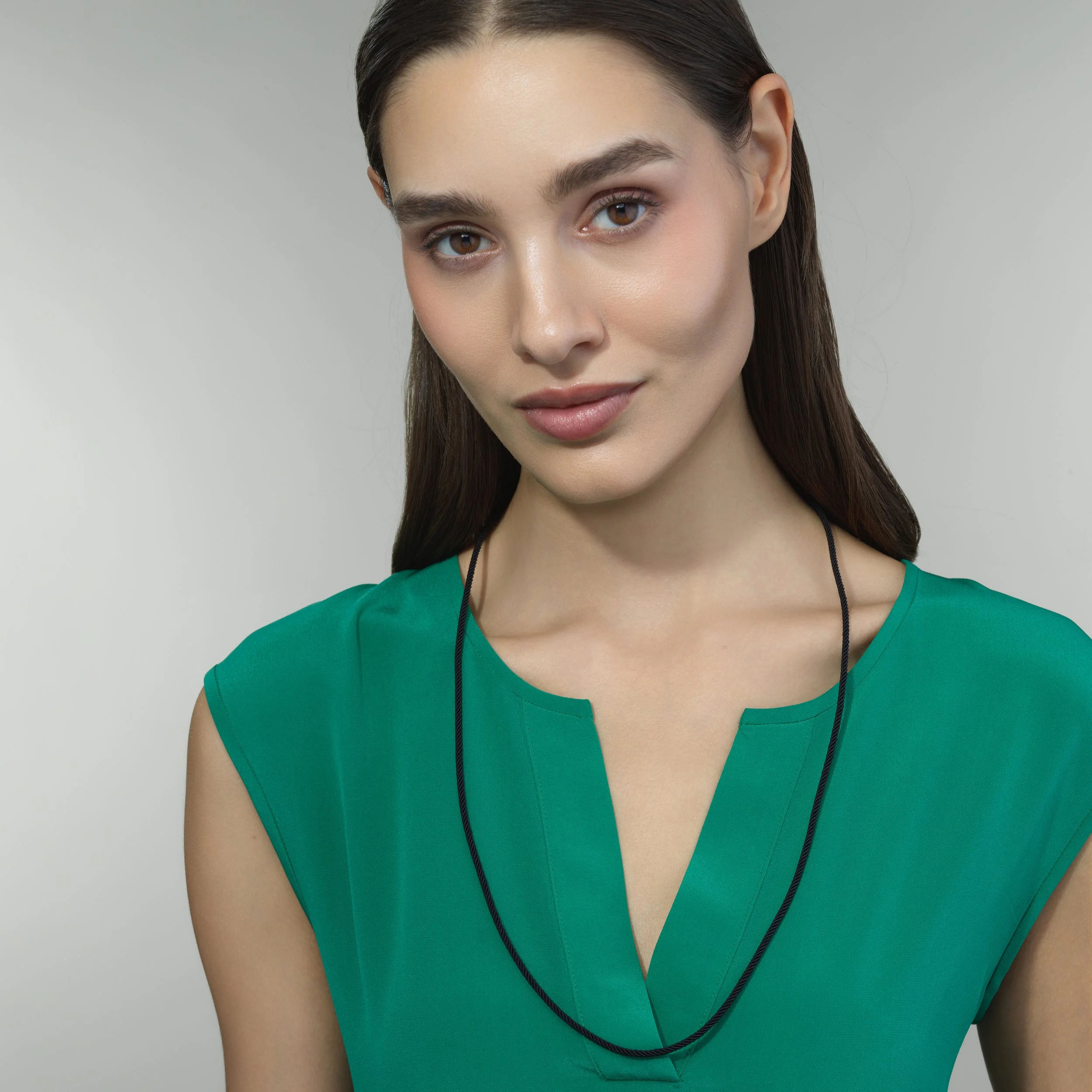 Black silk cord necklace shown worn on a model for scale