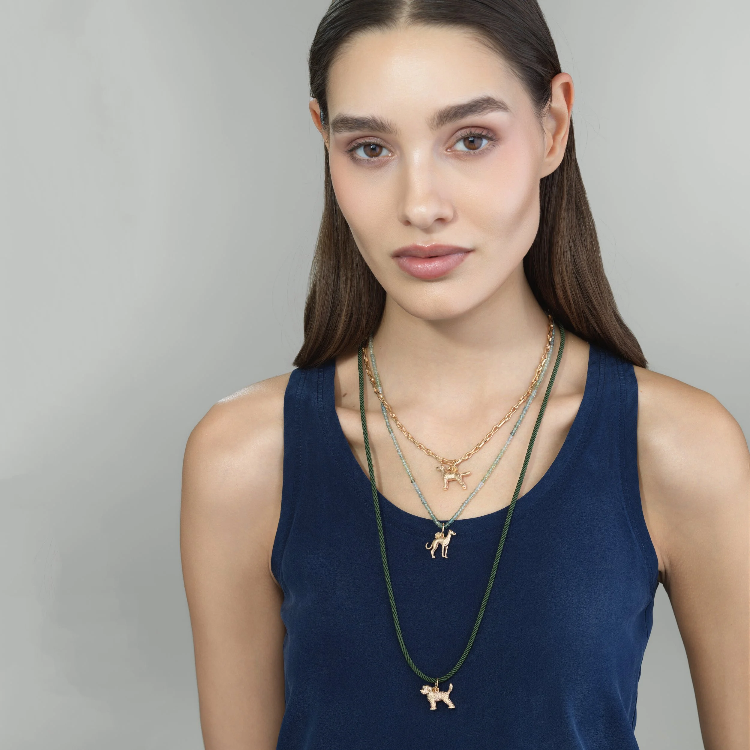 Dog Bone Chain in 18k gold shown worn on a model for scale