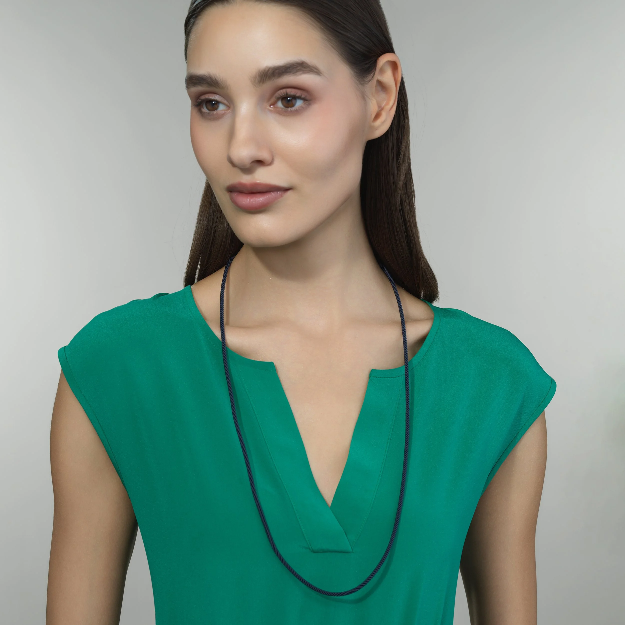 Blue silk cord necklace shown worn on a model for scale