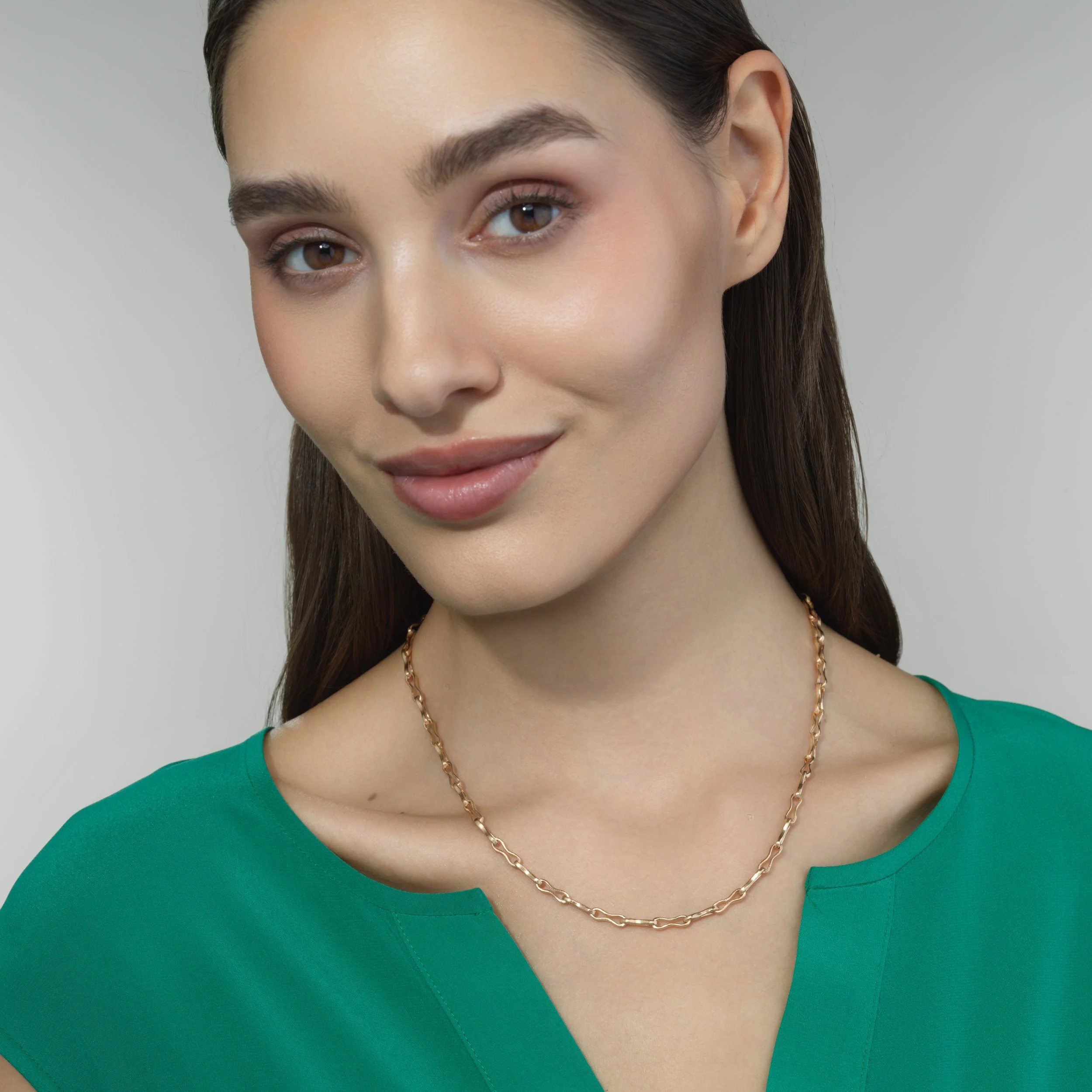 Dog Bone Chain in 18k gold shown worn on a model for scale