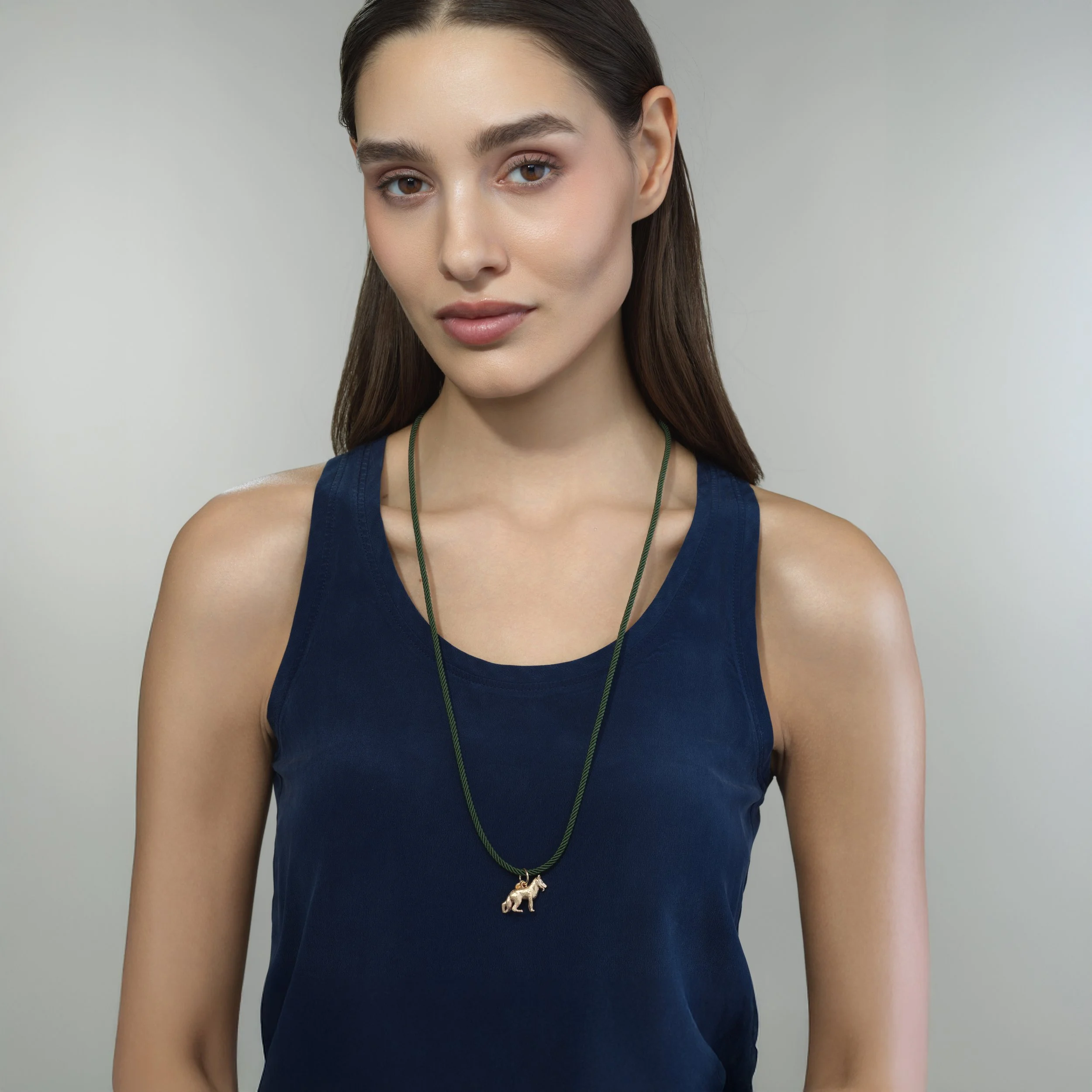 Green silk cord necklace shown worn on a model for scale