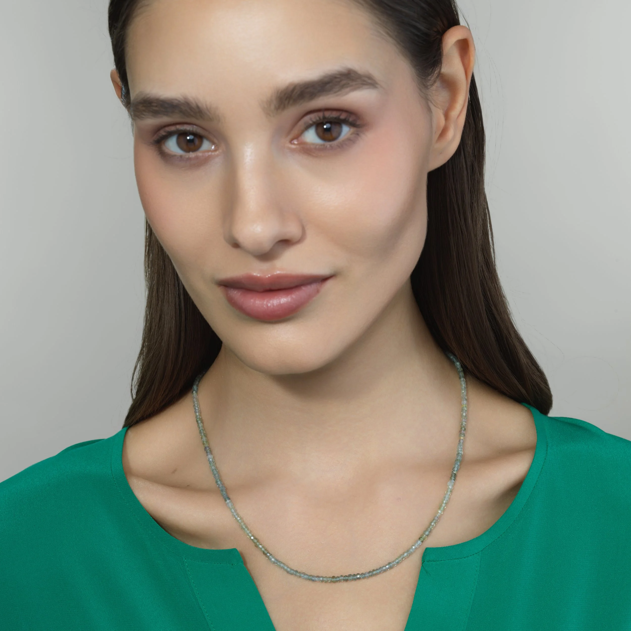 Montana sapphire bead necklace shown worn on a model for scale