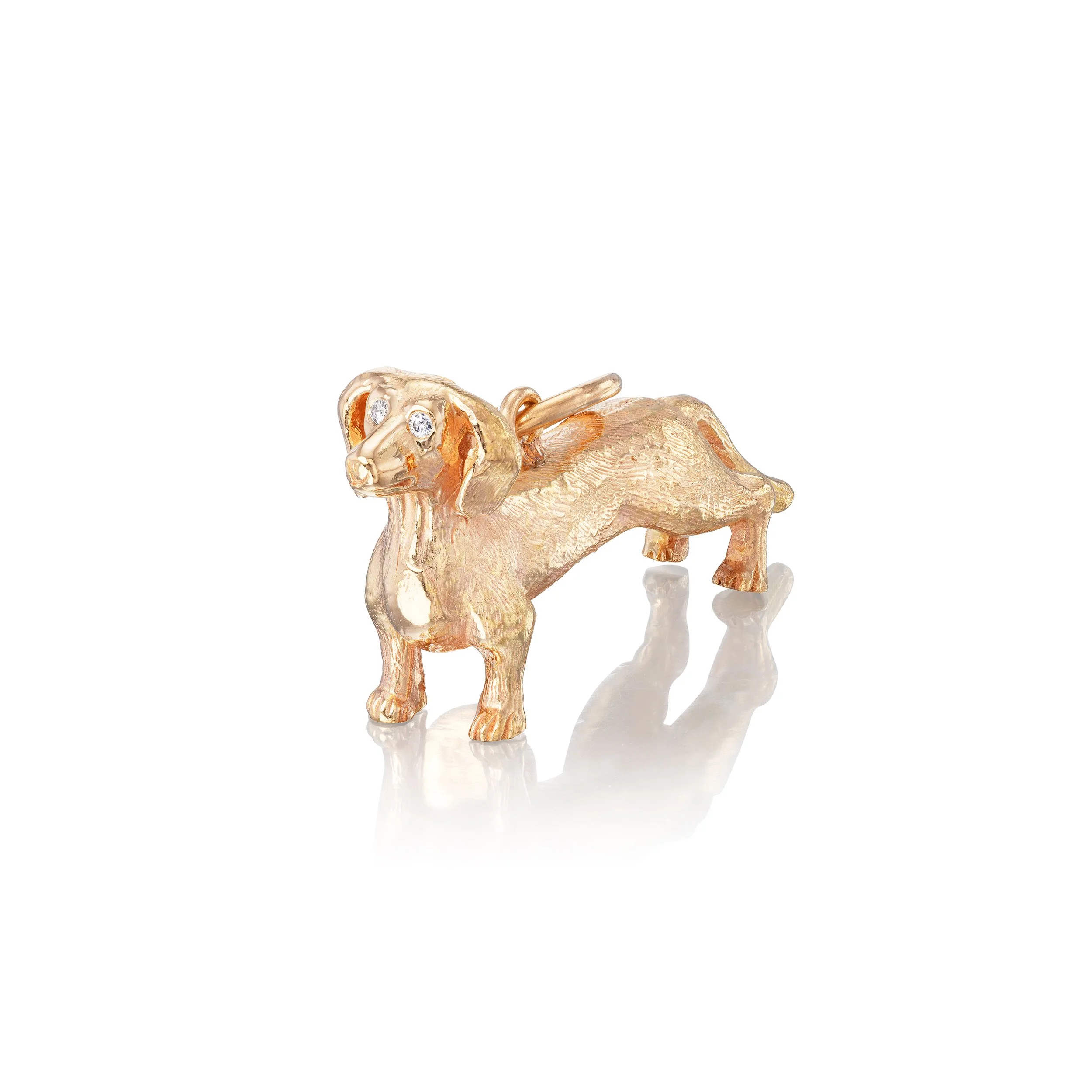Dachshund pendant in 18k gold with diamond eyes, front view