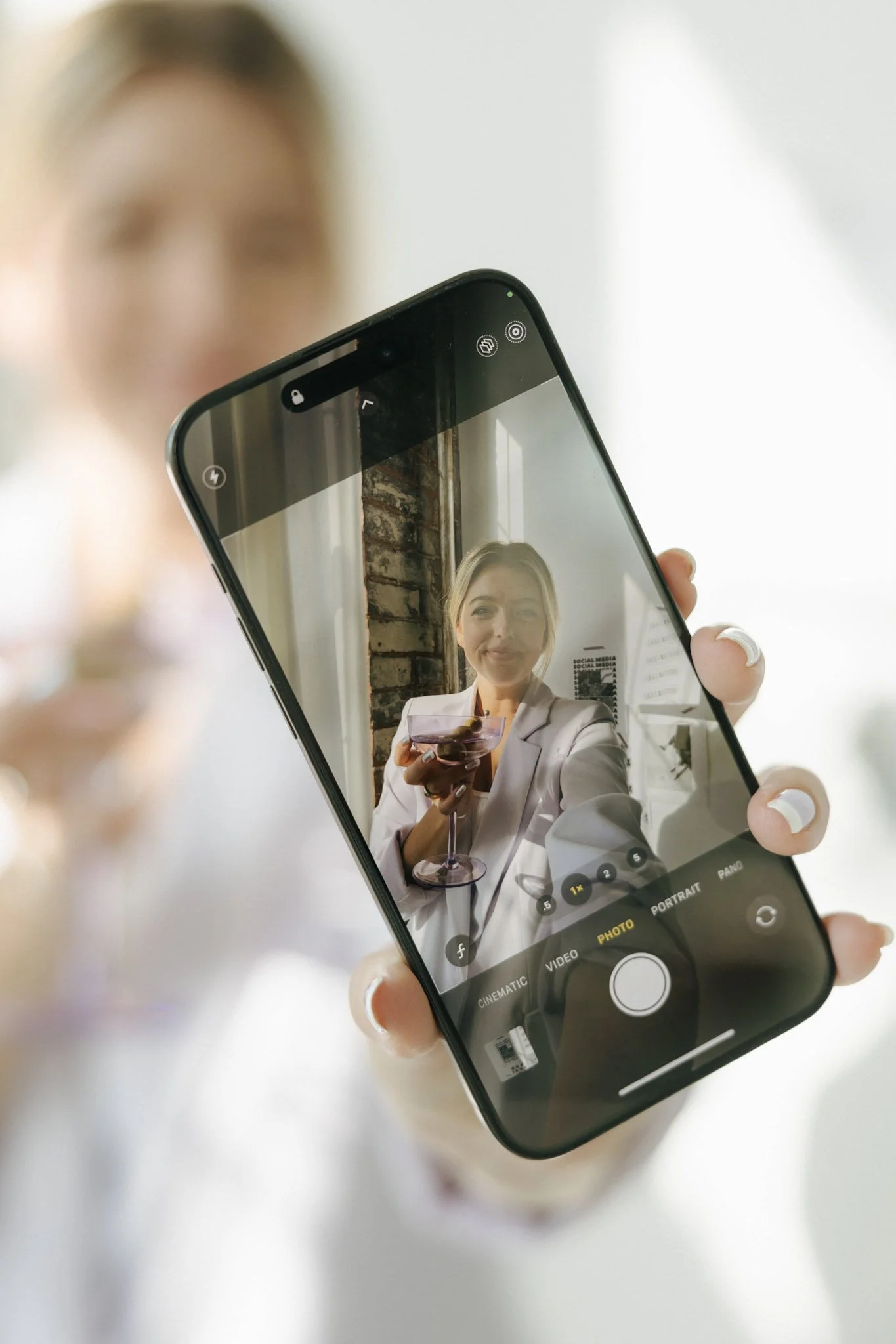 Phone camera view capturing professional headshot for LinkedIn personal branding content creation