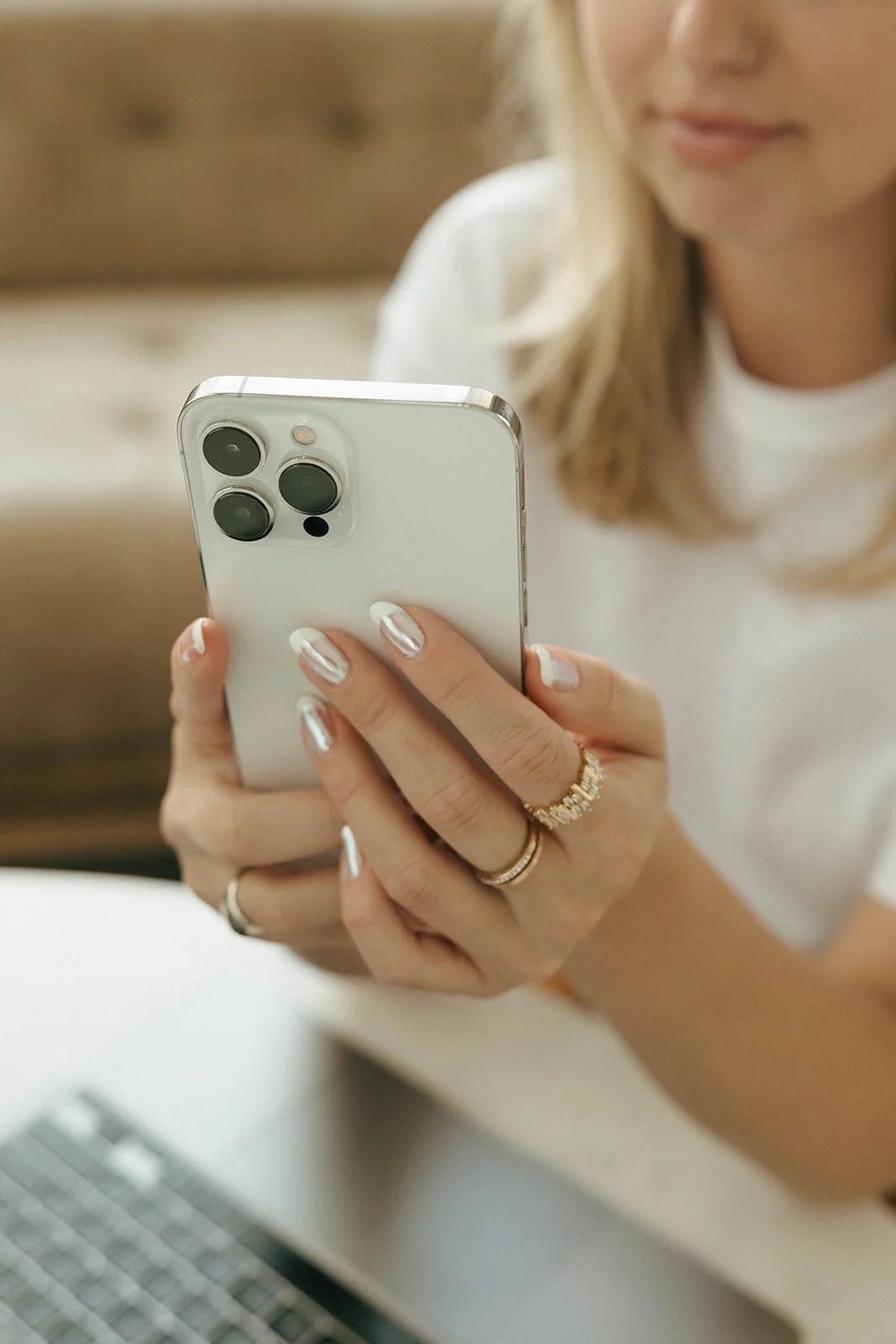 Client checking social media performance on phone during ongoing management partnership
