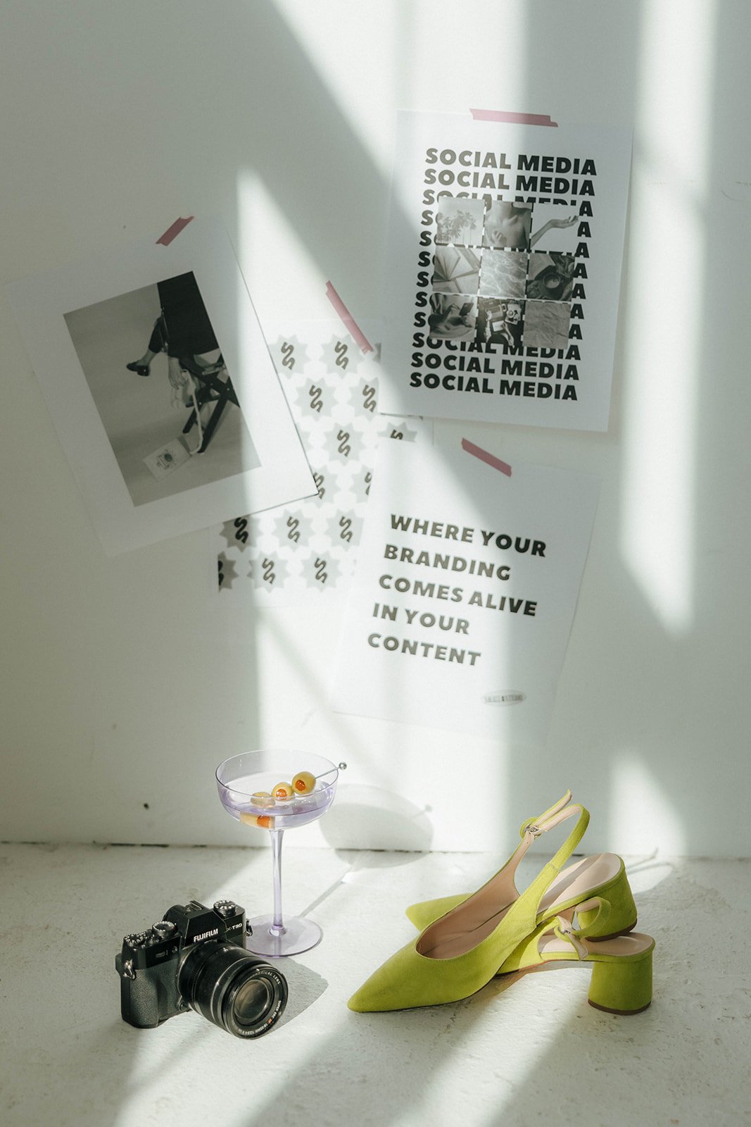 Styled workspace with camera and brand materials representing social media audit and strategy services