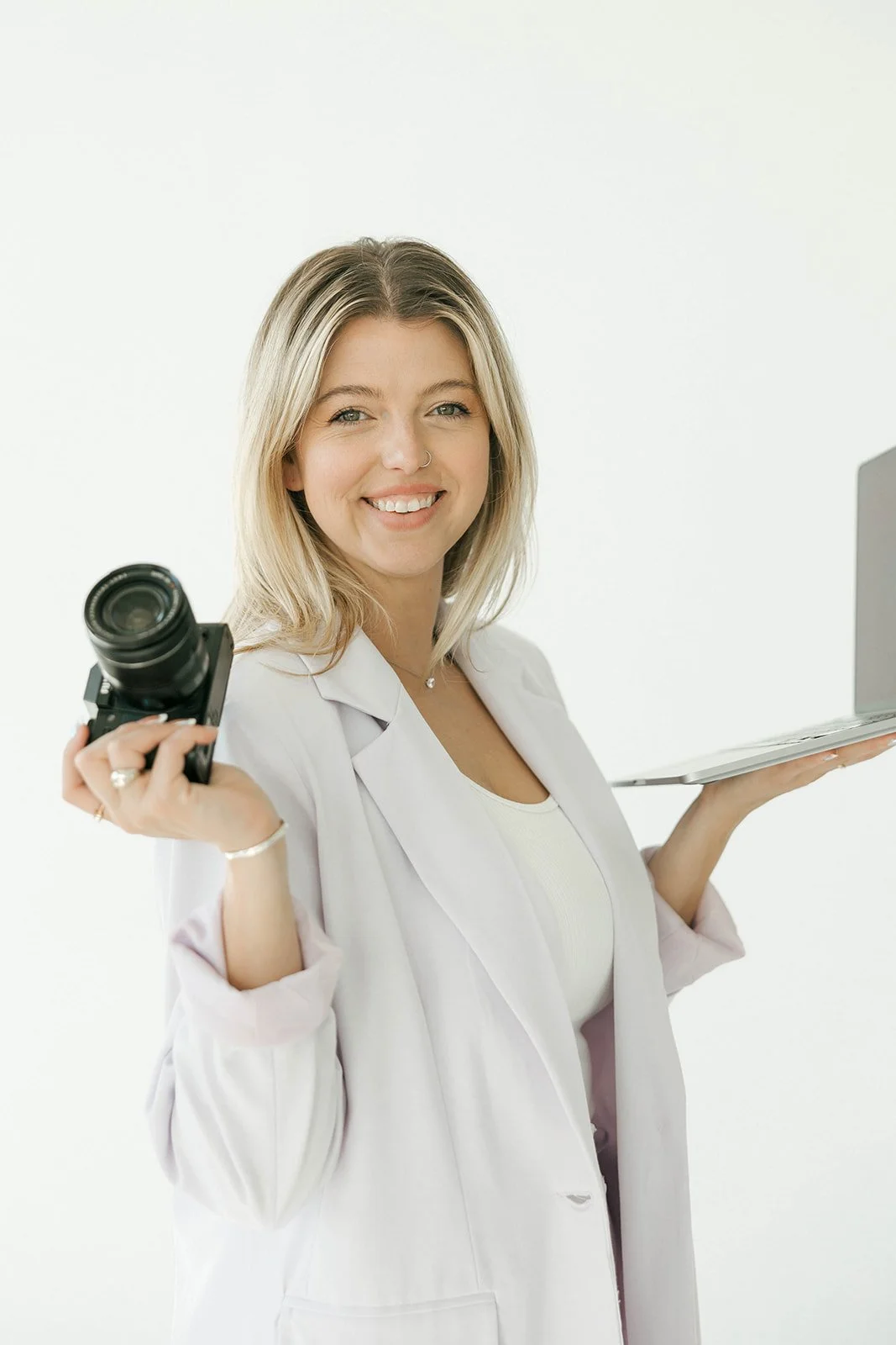 Ashton Henry with camera and laptop developing social media content strategy for service business