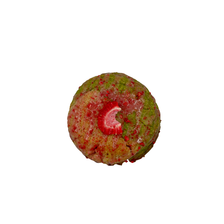 Red and green cookie with strawberry on top.
