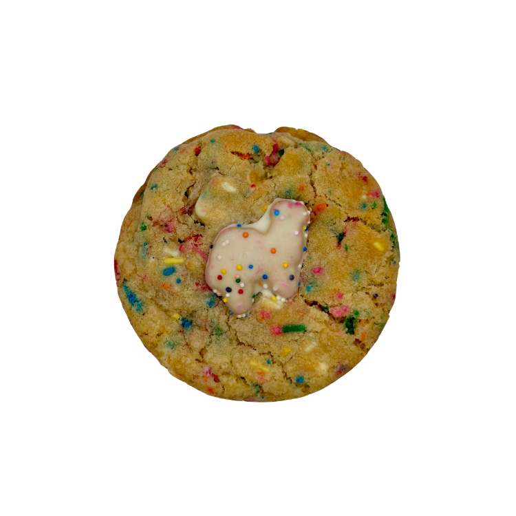 Cookie with sprinkles and frosted animal cookie on top.