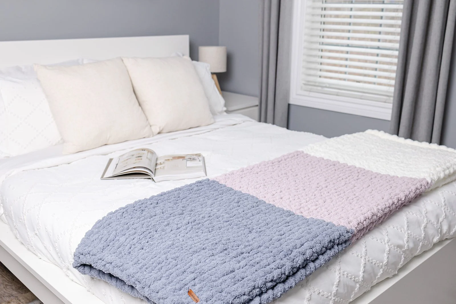 Cozy dini chunky knit throw folded in a neutral living room