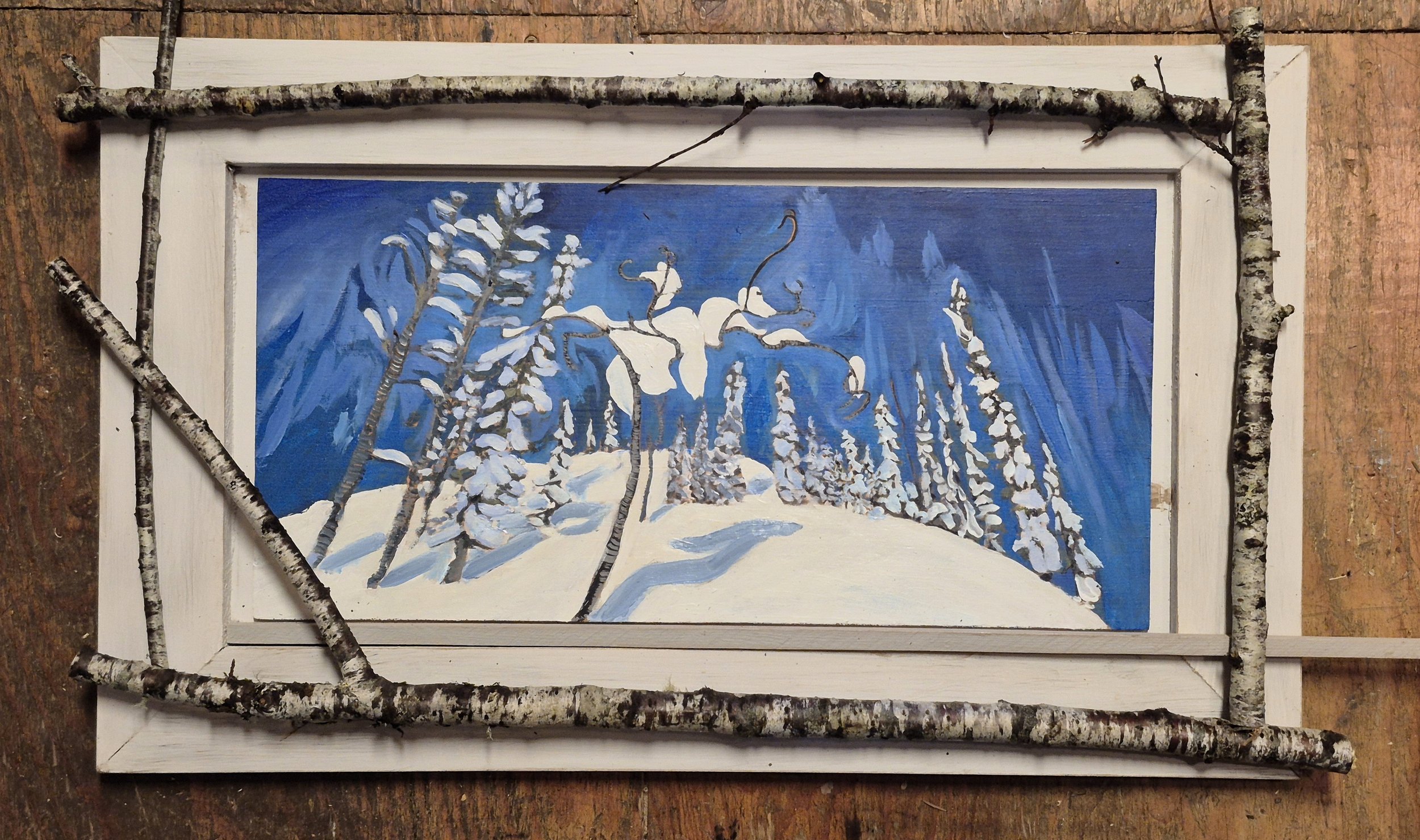 Cherry branches surround the oil painting of the North. Trees reach for the sky as the small cherry laden with snow is painted in the foreground. 