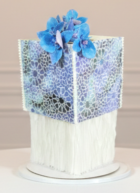 Bespoke Agricultural two-tiered wedding cake for 60 guests. Features elegant, handcrafted wafer paper orchid flowers. Two custom flavours. Unique and elegant wedding cakes in Calgary by Magnolia Couture Cakery.