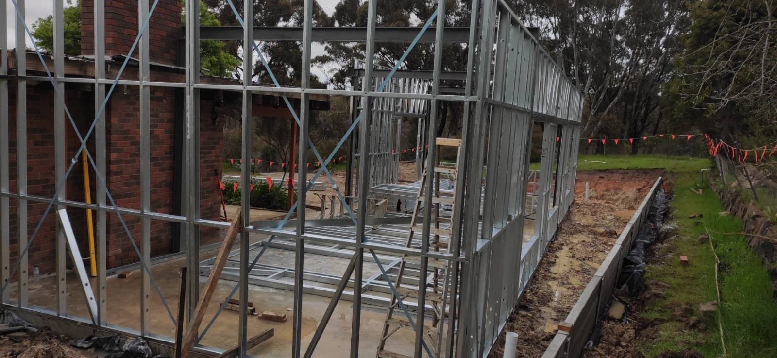 Construction of the meditation hall and views of the completed building.