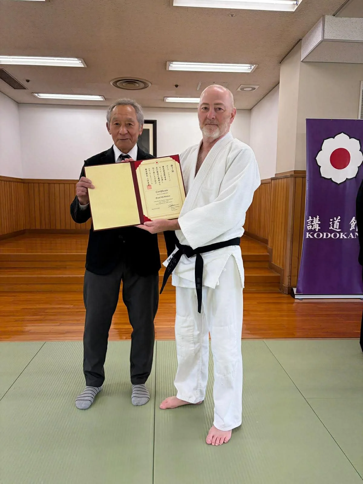 Boyd with Sensei Doba (8th Dan), head of the grading panel.
