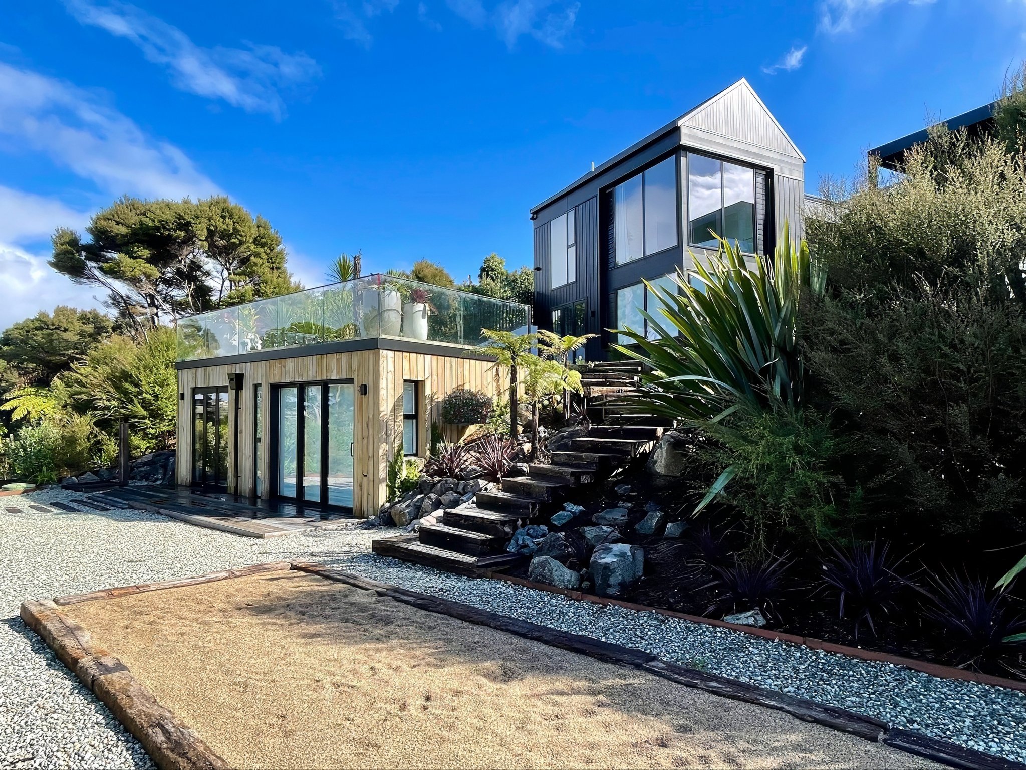 Sand Dune new home outdoor steps with tropical garden planting, Mangawhai