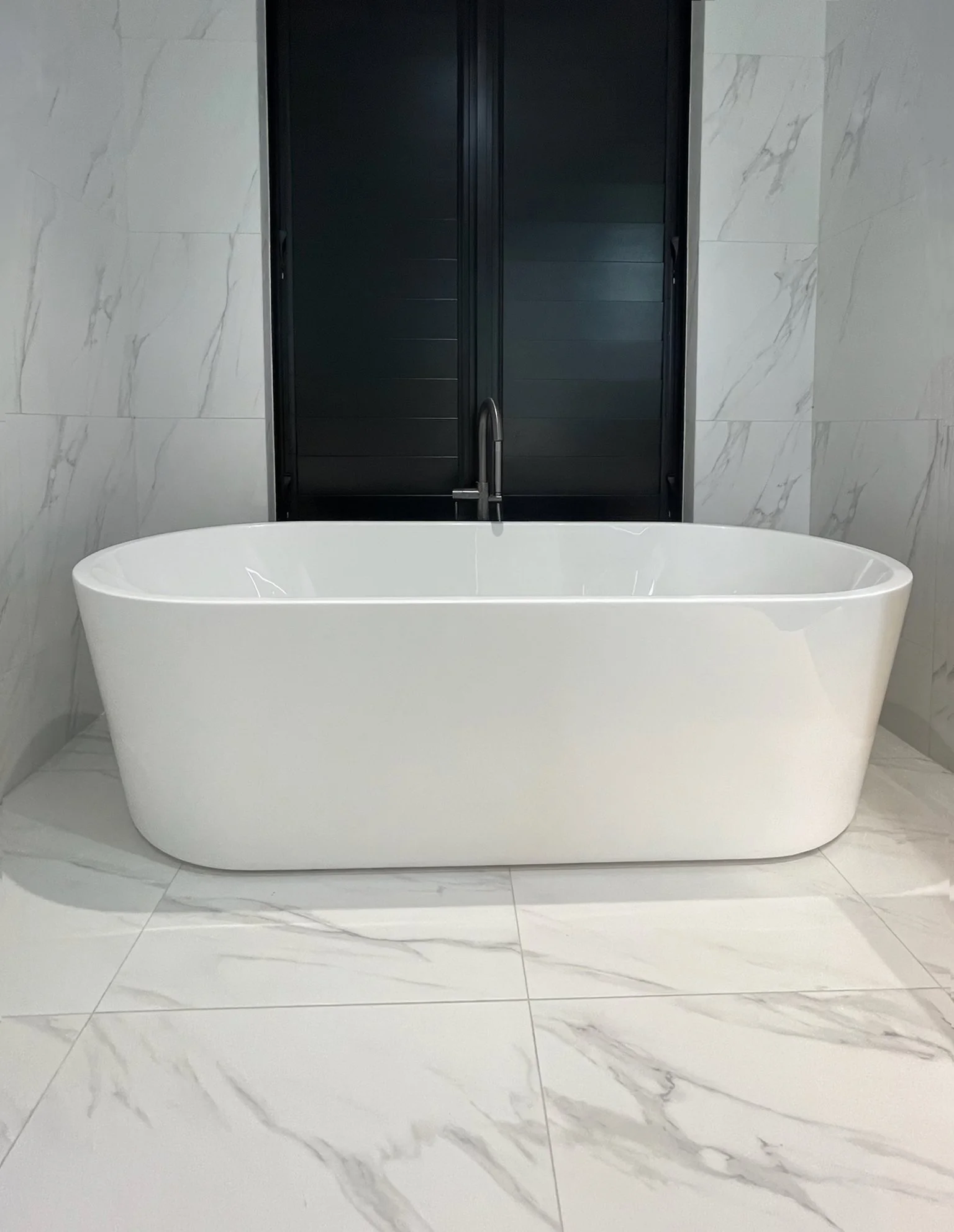 Sand Dune luxury bathroom with freestanding bath and marble tiles, Elite Building Mangawhai