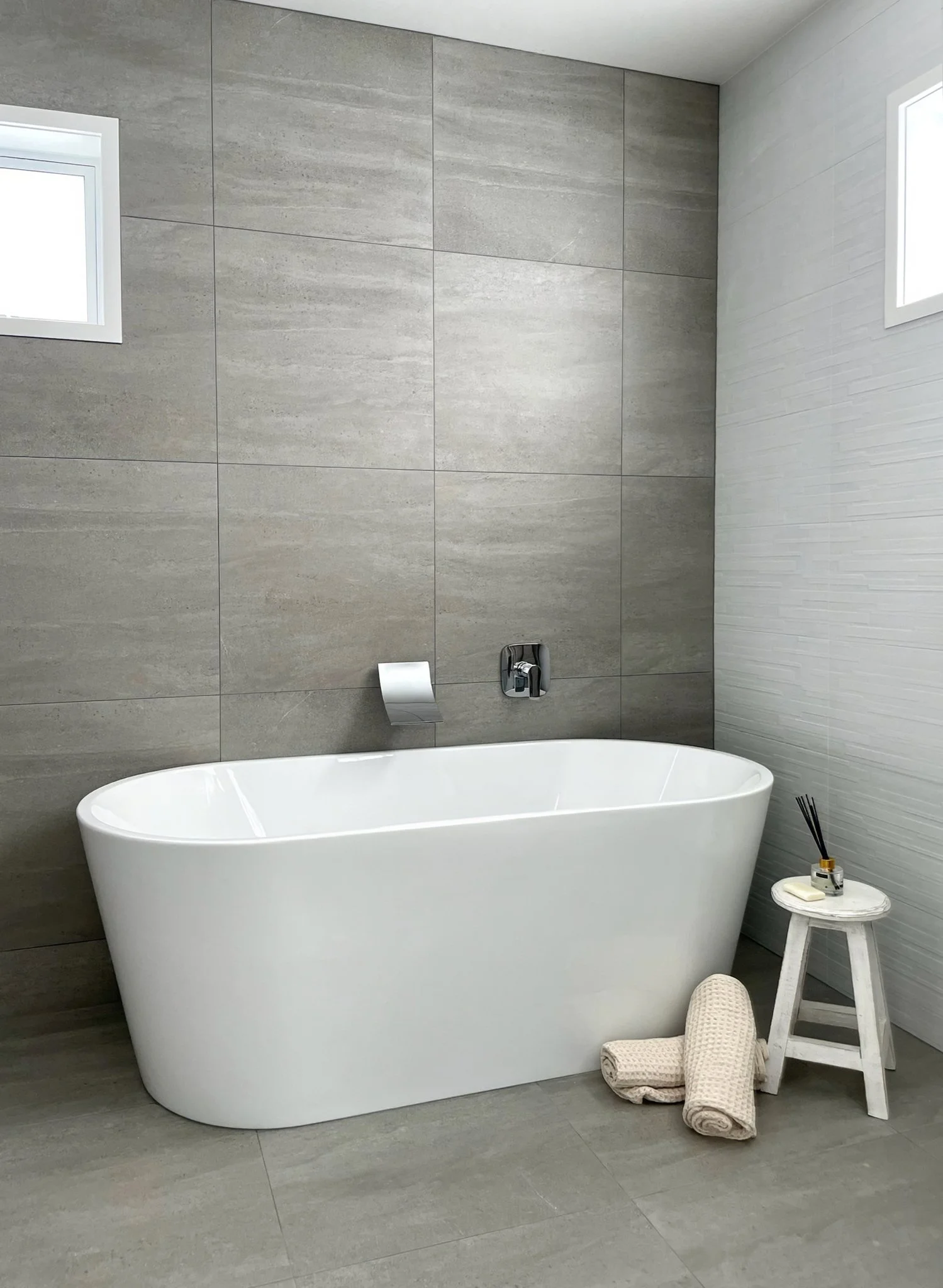 Luxury bathroom with freestanding bathtub and floor to ceiling tiles, Elite Building Mangawhai