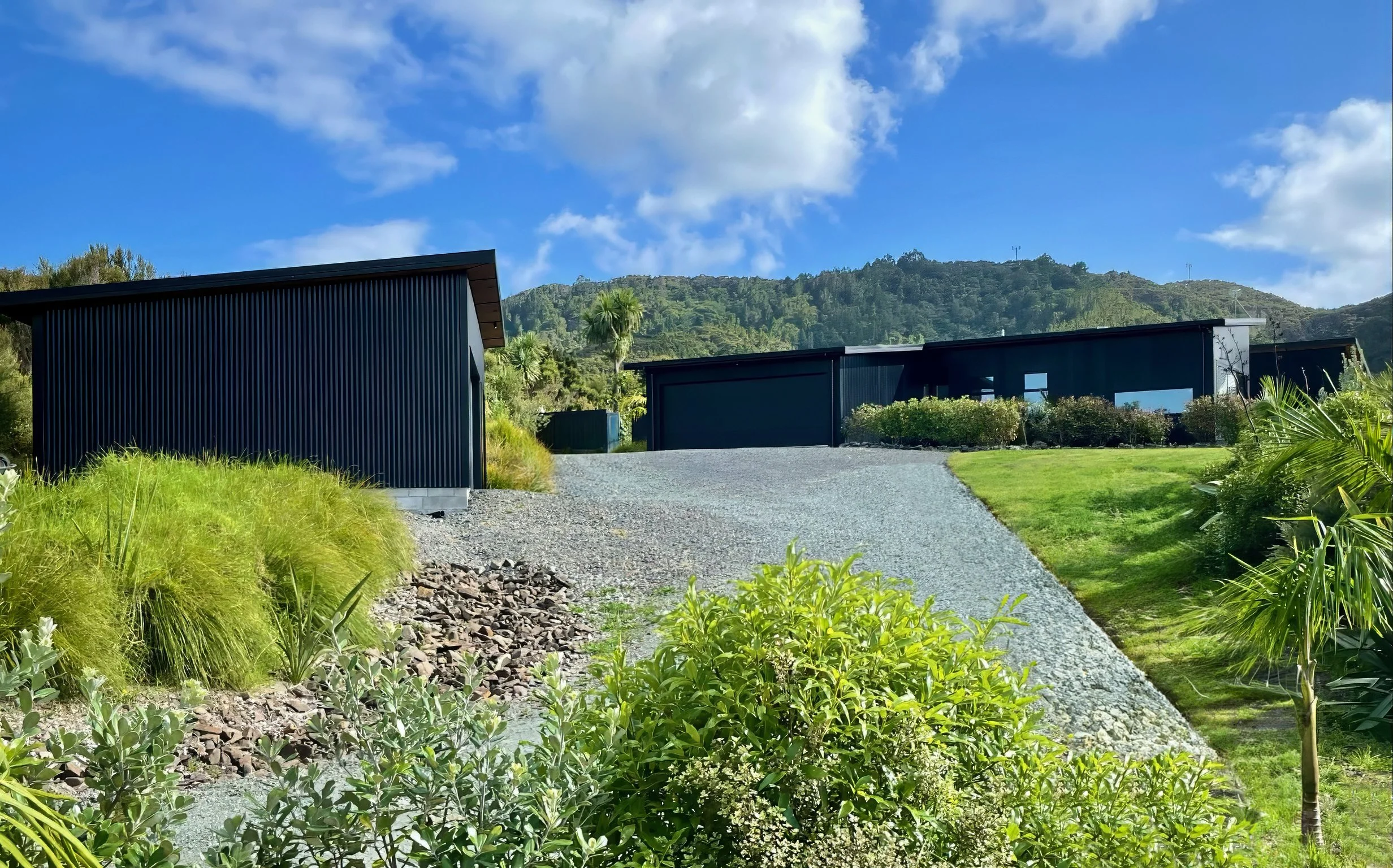 Sanctuary Ridgeview new home dark cladding exterior entrance driveway, Elite Building Mangawhai