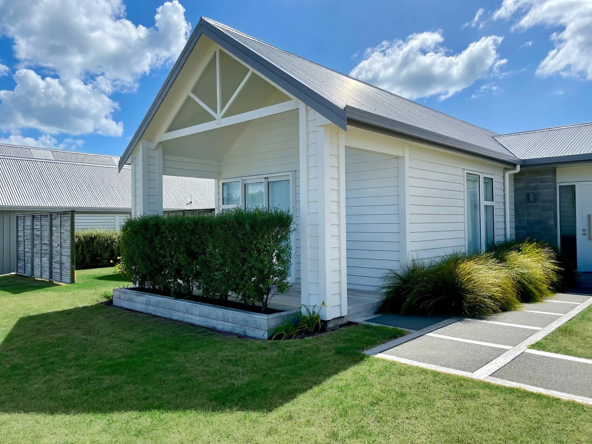 Stingray luxury new home exterior and landscaped gardens, Mangawhai