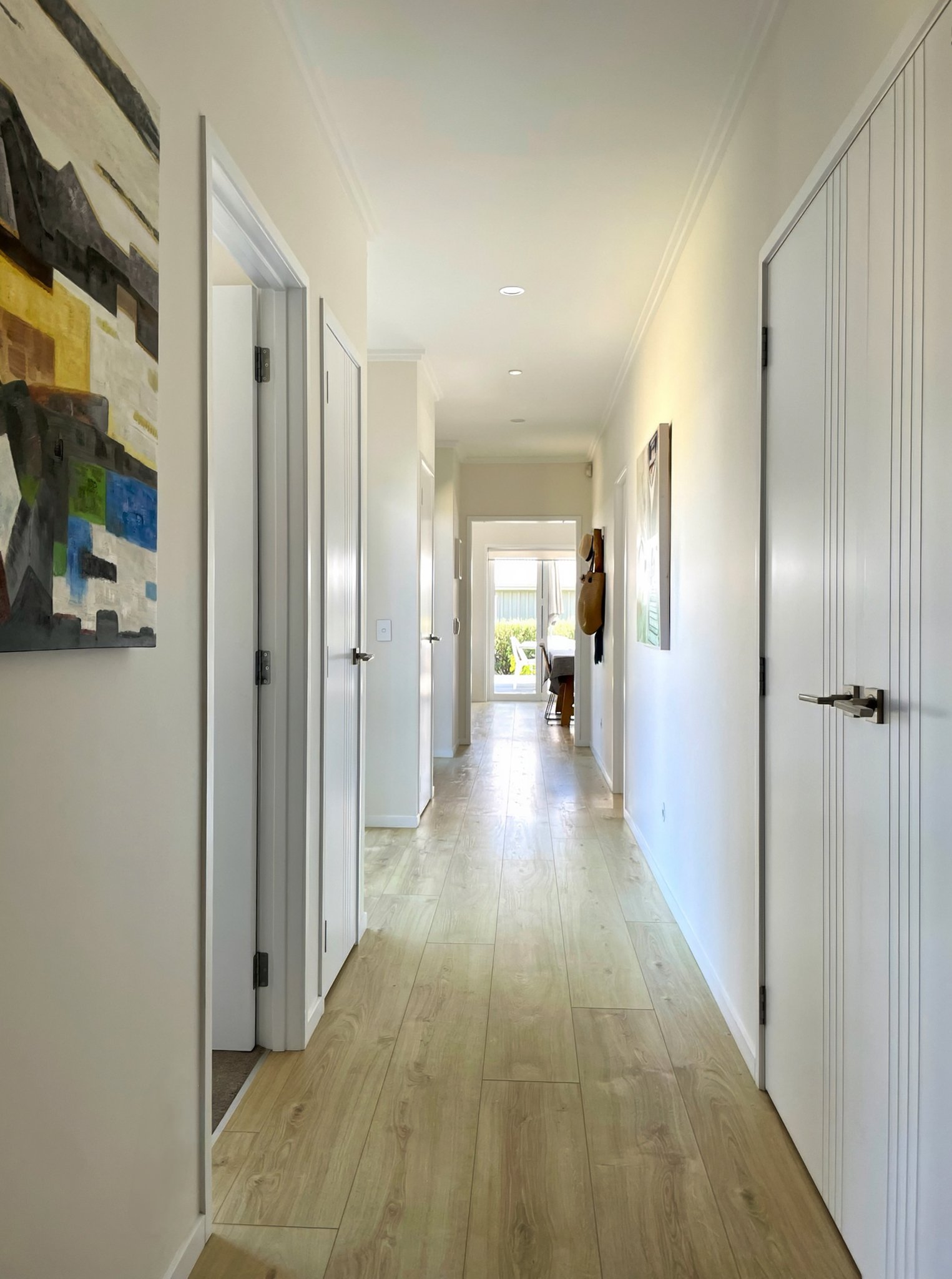 Stingray new home hallway with timber flooring and natural light, Elite Building Mangawhai
