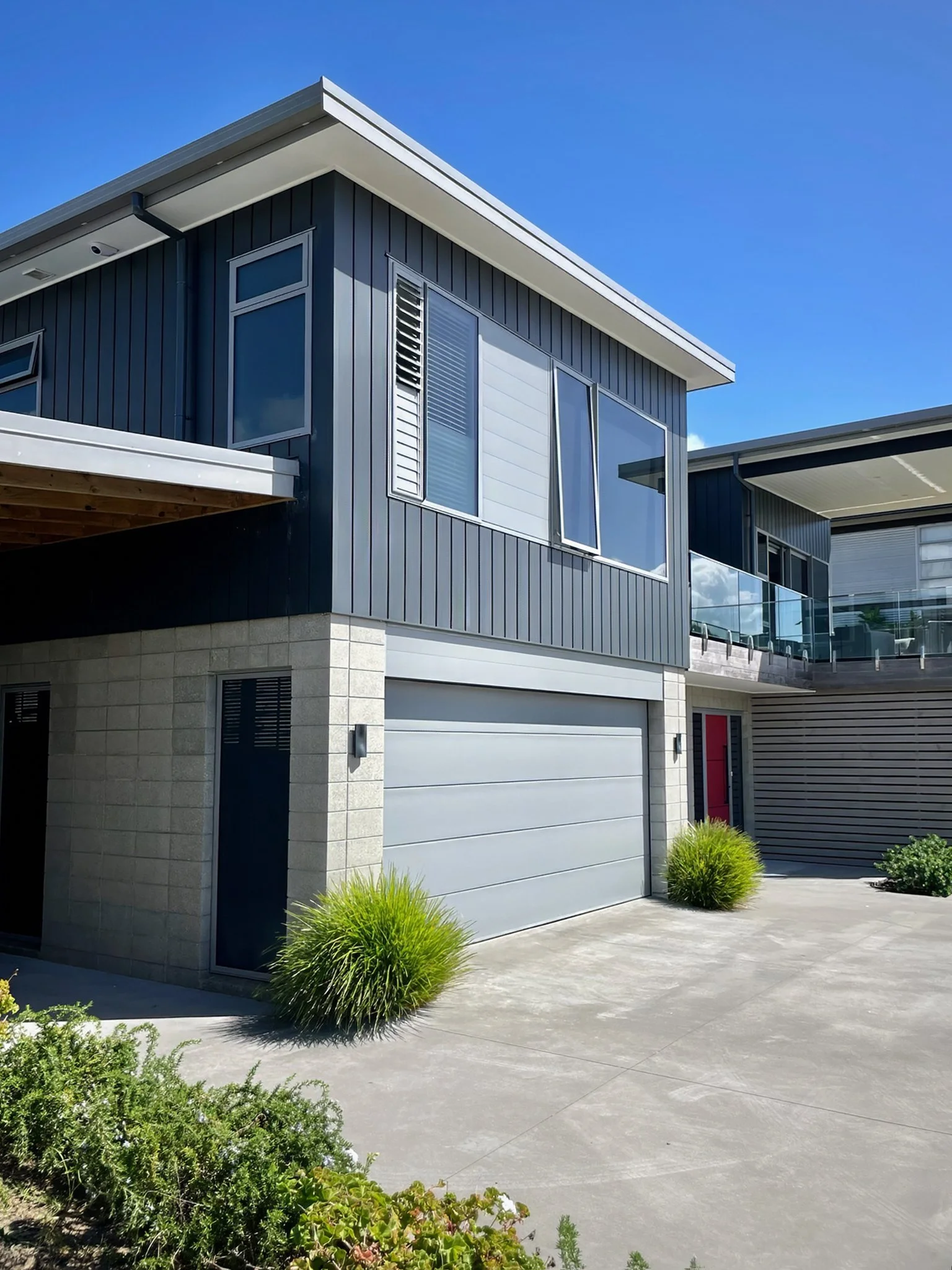 Driftwood new home build with double garage and dark cladding, Northland